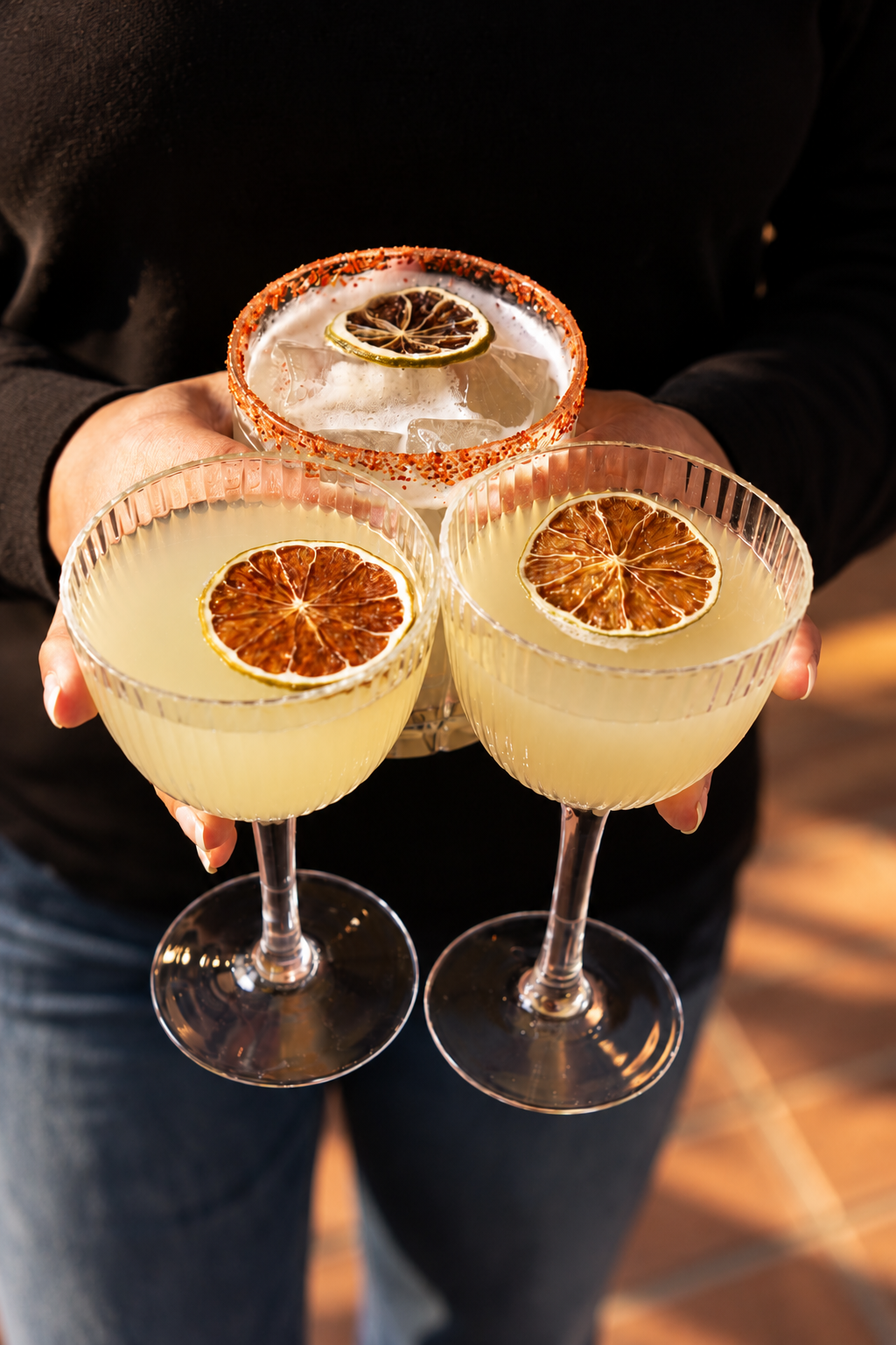 Two Peaches Margaritas and a chilli salt rimmed margarita held at Good Heavens Rooftop Bar, Melbourne