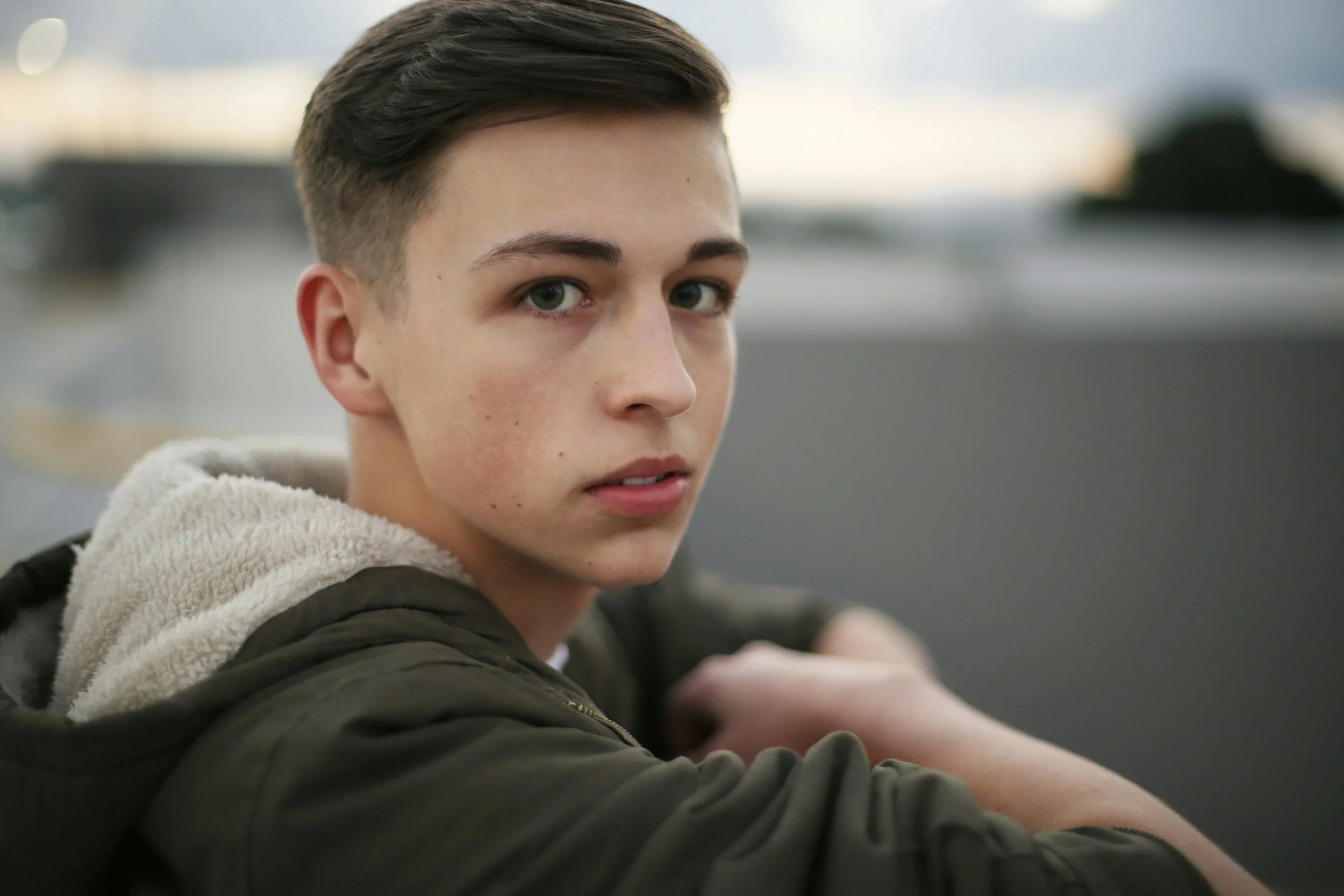 angry teen boy looking at camera