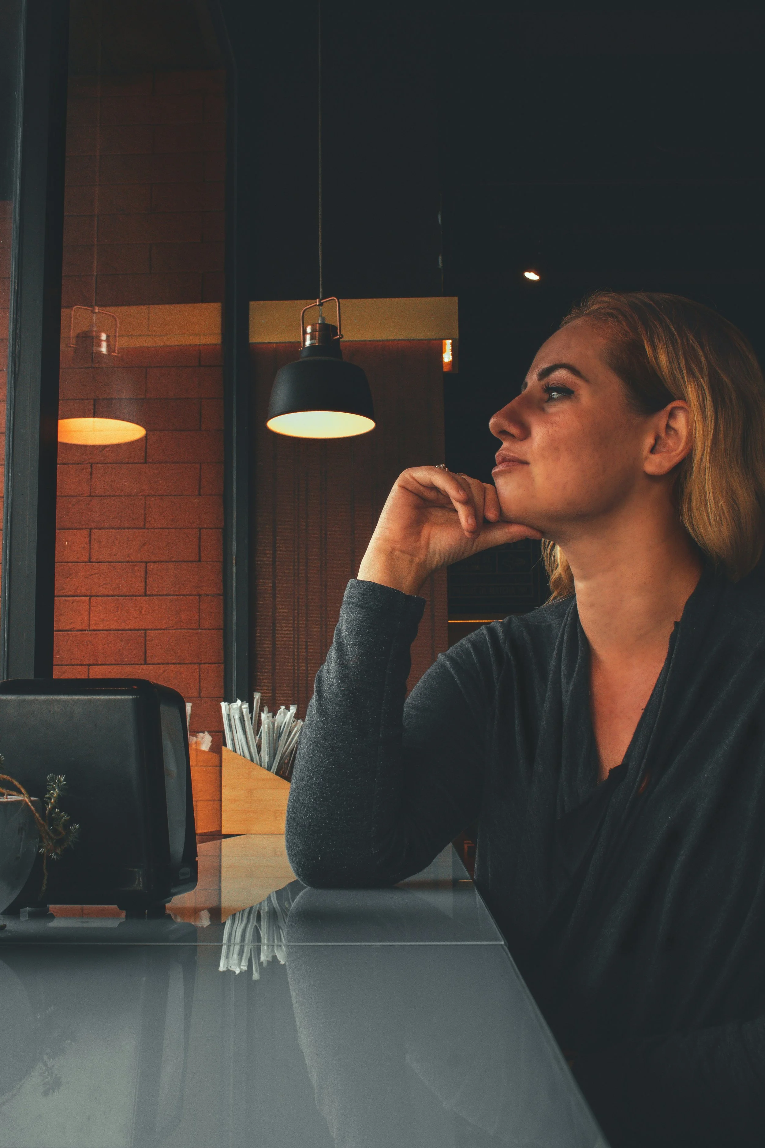 woman sitting in home weighing decision about therapy intensive