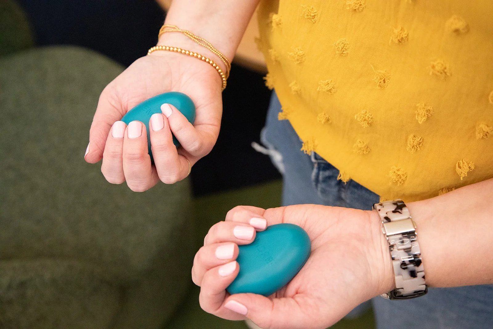 woman holding EMDR tappers