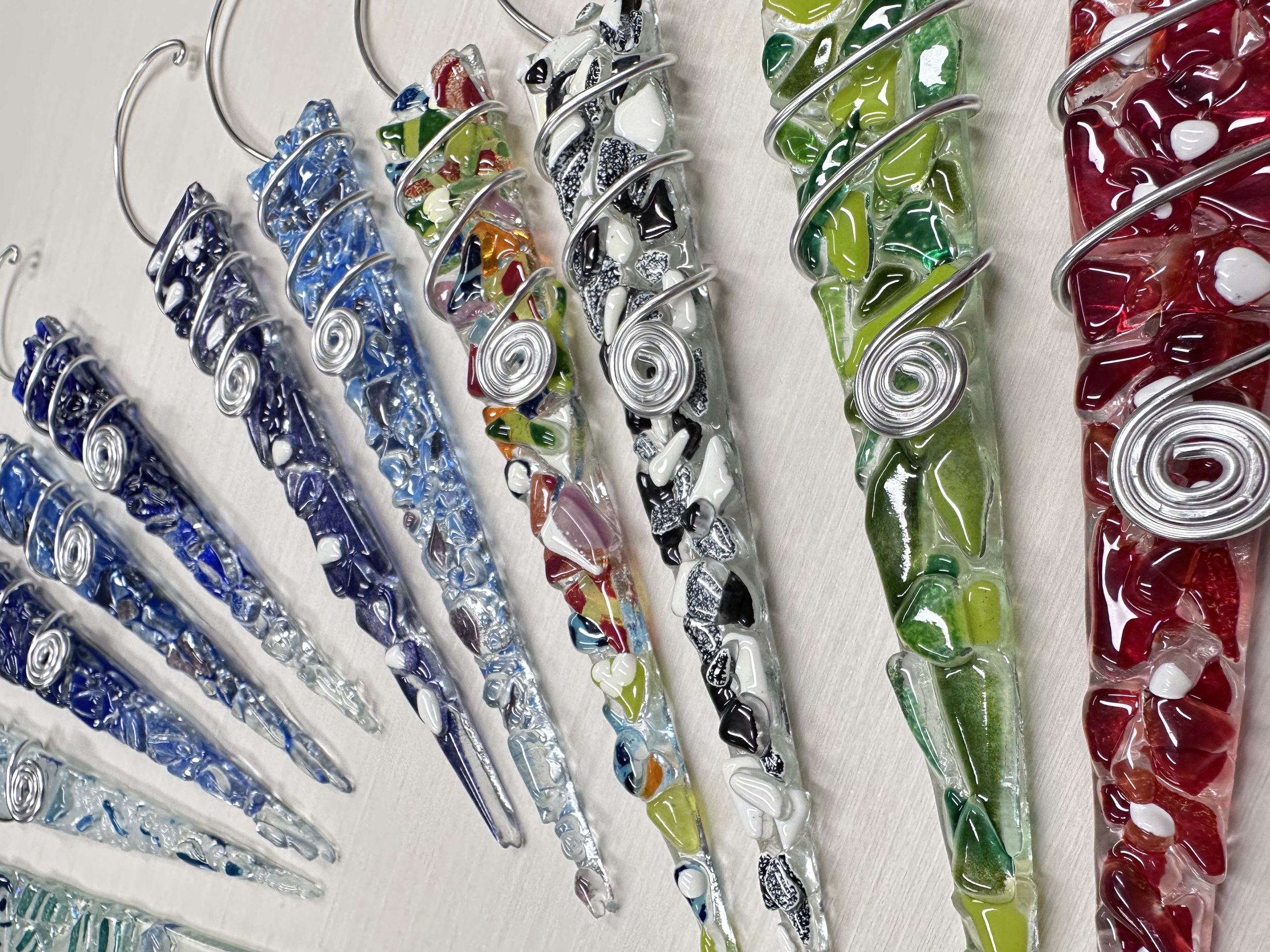 Icicle Ornament ($15) 30-1hr
These classy icicles look great in your window or on your tree.  They make great gifts. Make them any color you like, design with mosaic glass, or sift colored glass powders on top.  Paint names, initials, or dates on/bet