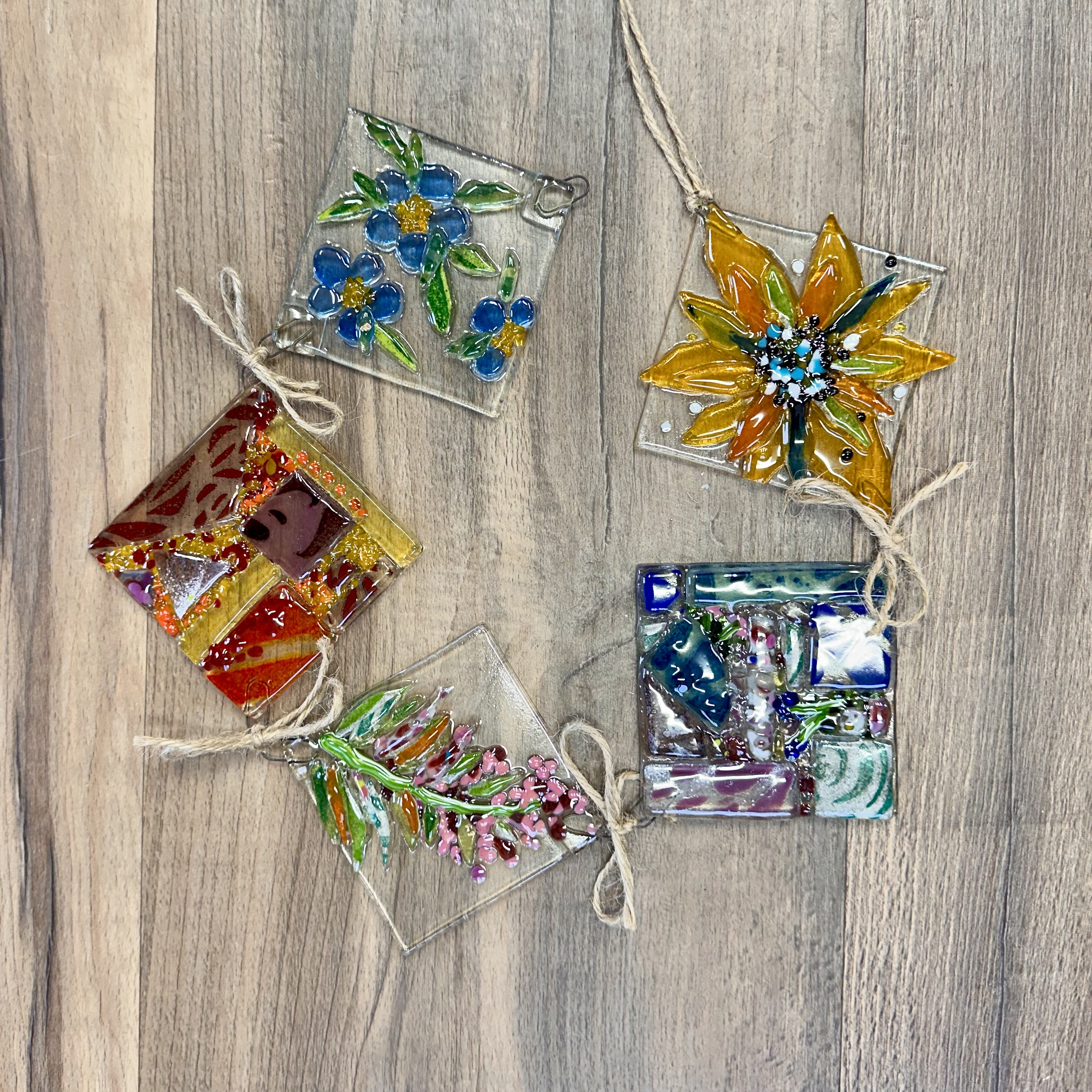 Rain Chain ($72) Est. 2 hrs. 
Design 5 precut 3”x3” squares, or create your own shapes in this size range. Nip and cut custom mosaic glass, choose to add frit, bubbles, paints and sift glass powders to create unique vibrant designs. I have some templ