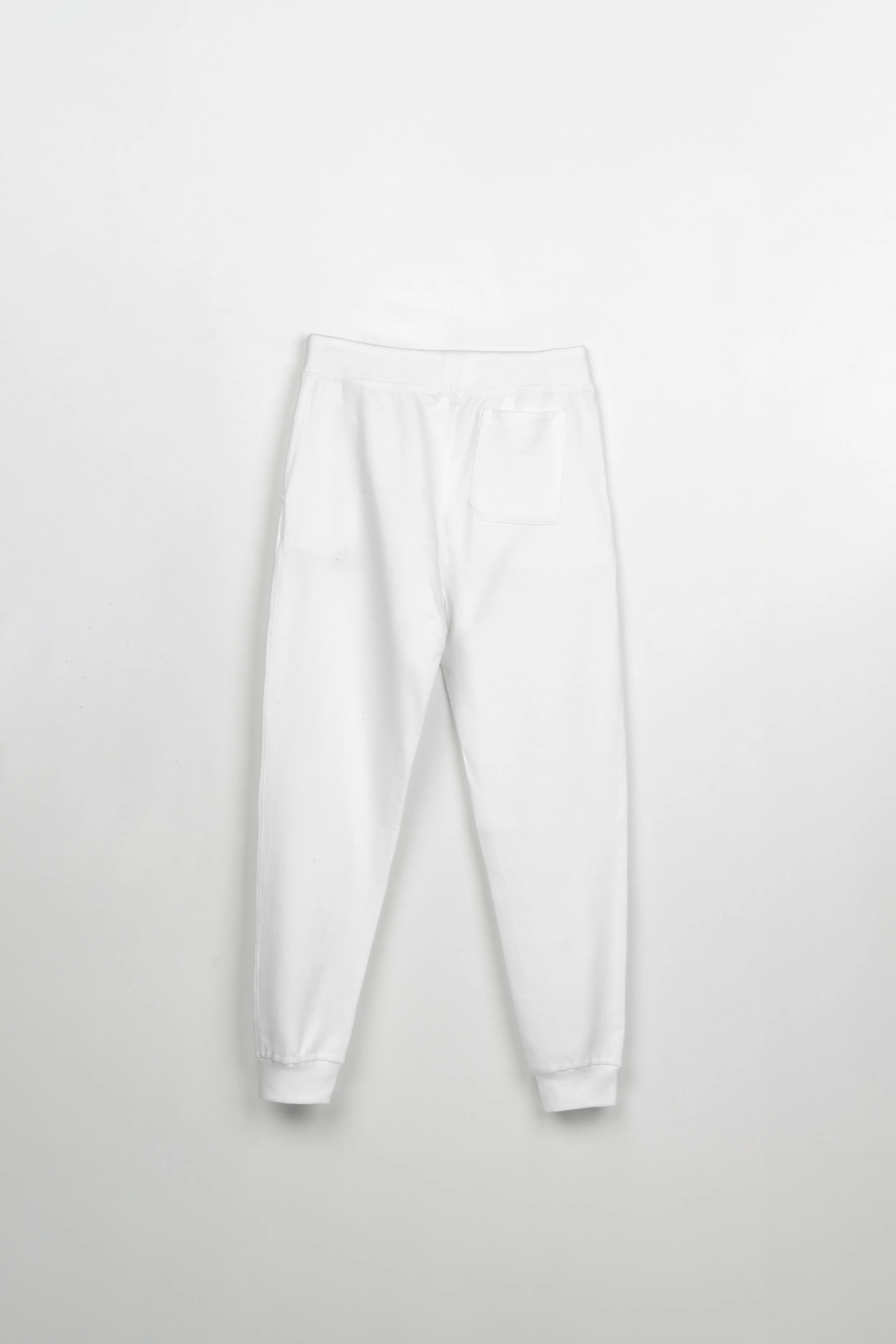 ADVIKATE Classic Trackpants Series II in White, back flat lay, showing back fit and pocket placement.
