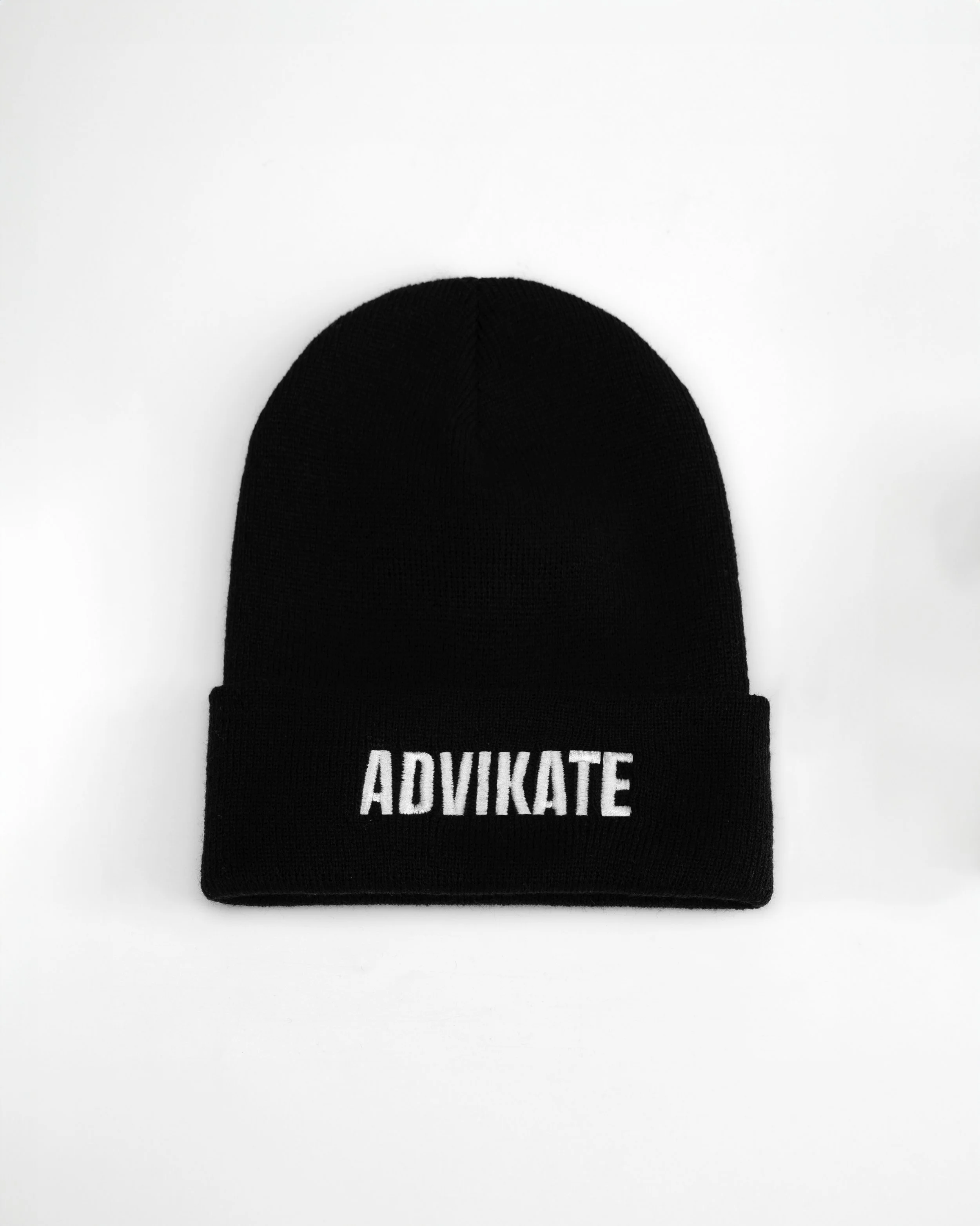 ADVIKATE Classic Beanie Series II in Black, front flat lay, showing ADVIKATE text embroidery on the cuff.