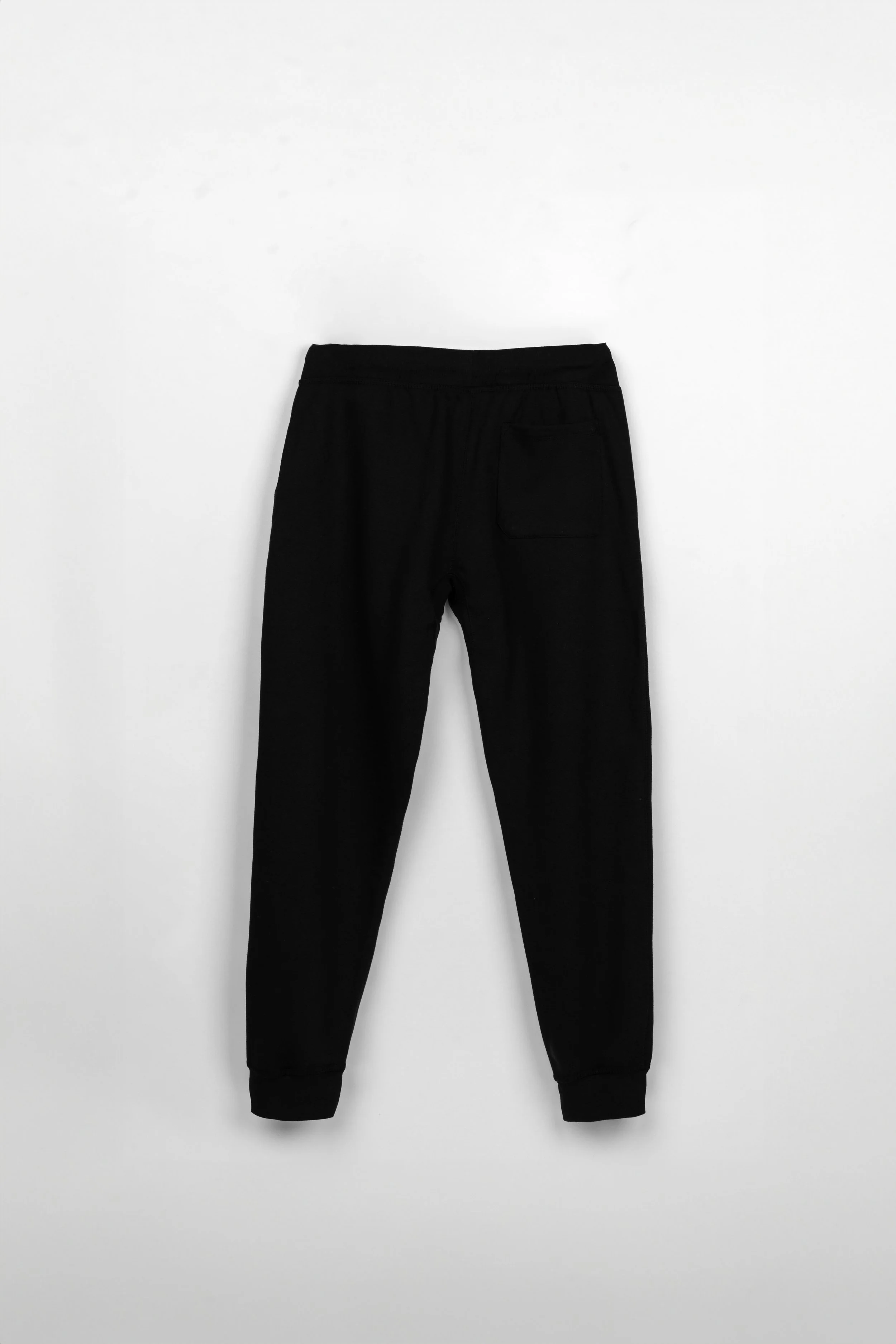 ADVIKATE Classic Trackpants Series I in Black, back flat lay, showing back fit and pocket placement.