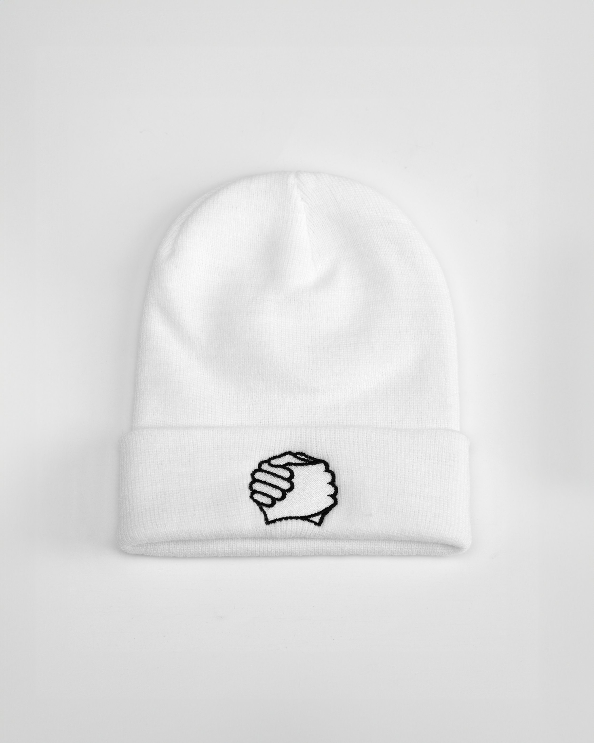 ADVIKATE Classic Beanie Series I in White, front flat lay, showing clasped-hands embroidery on the cuff.
