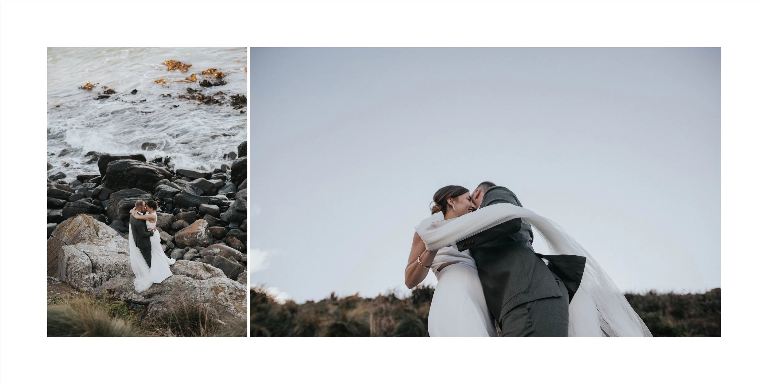 Couple in wedding attire embracing on rocky beach and sharing a kiss with sky in background.