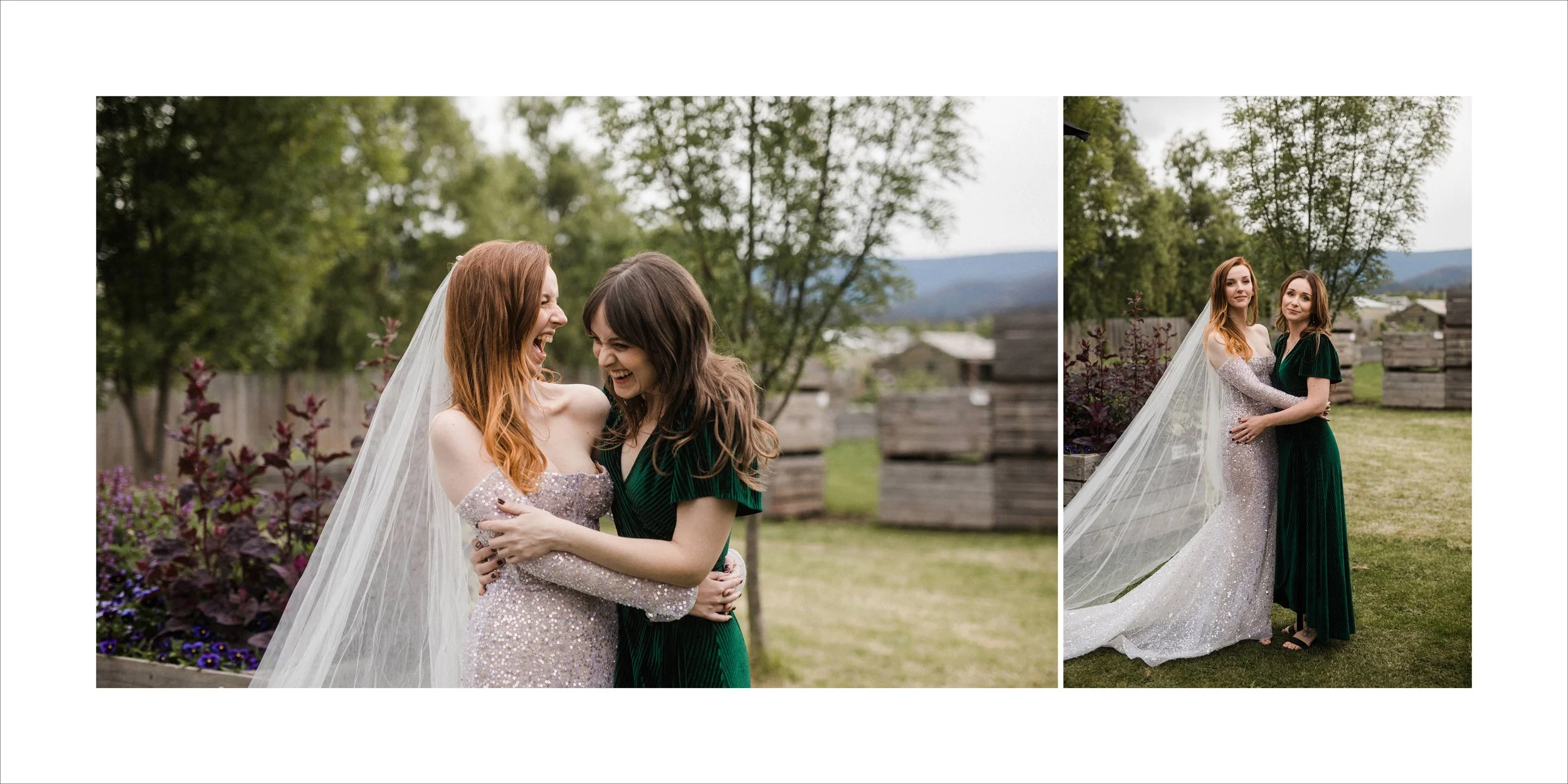 Two women, one in a sparkly wedding dress with veil and the other in a green dress, embracing and smiling outdoors with trees and wooden planters in the background.
