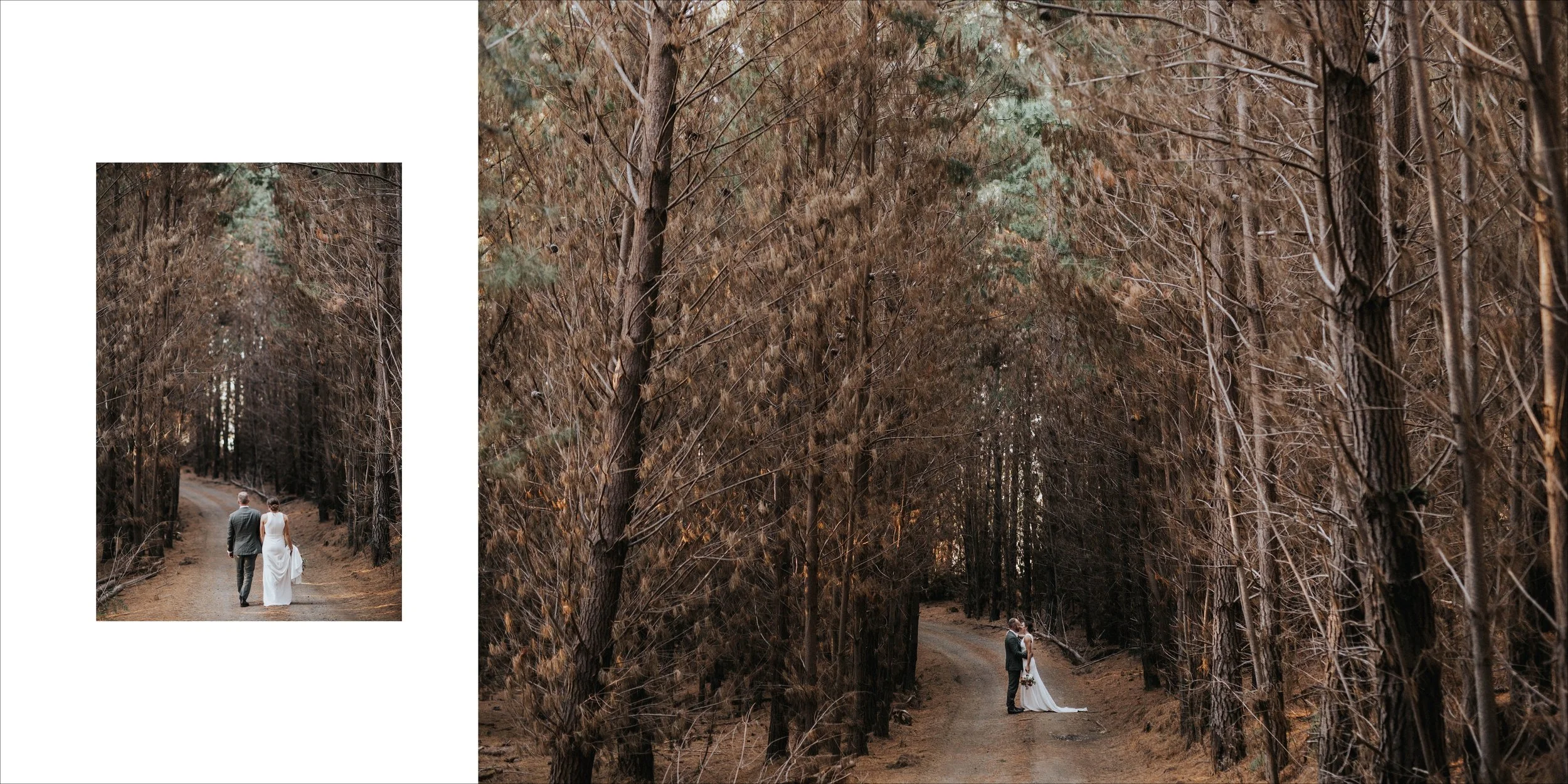 A bride and groom holding hands and walking along a dirt path in a dense forest with tall, brown trees.