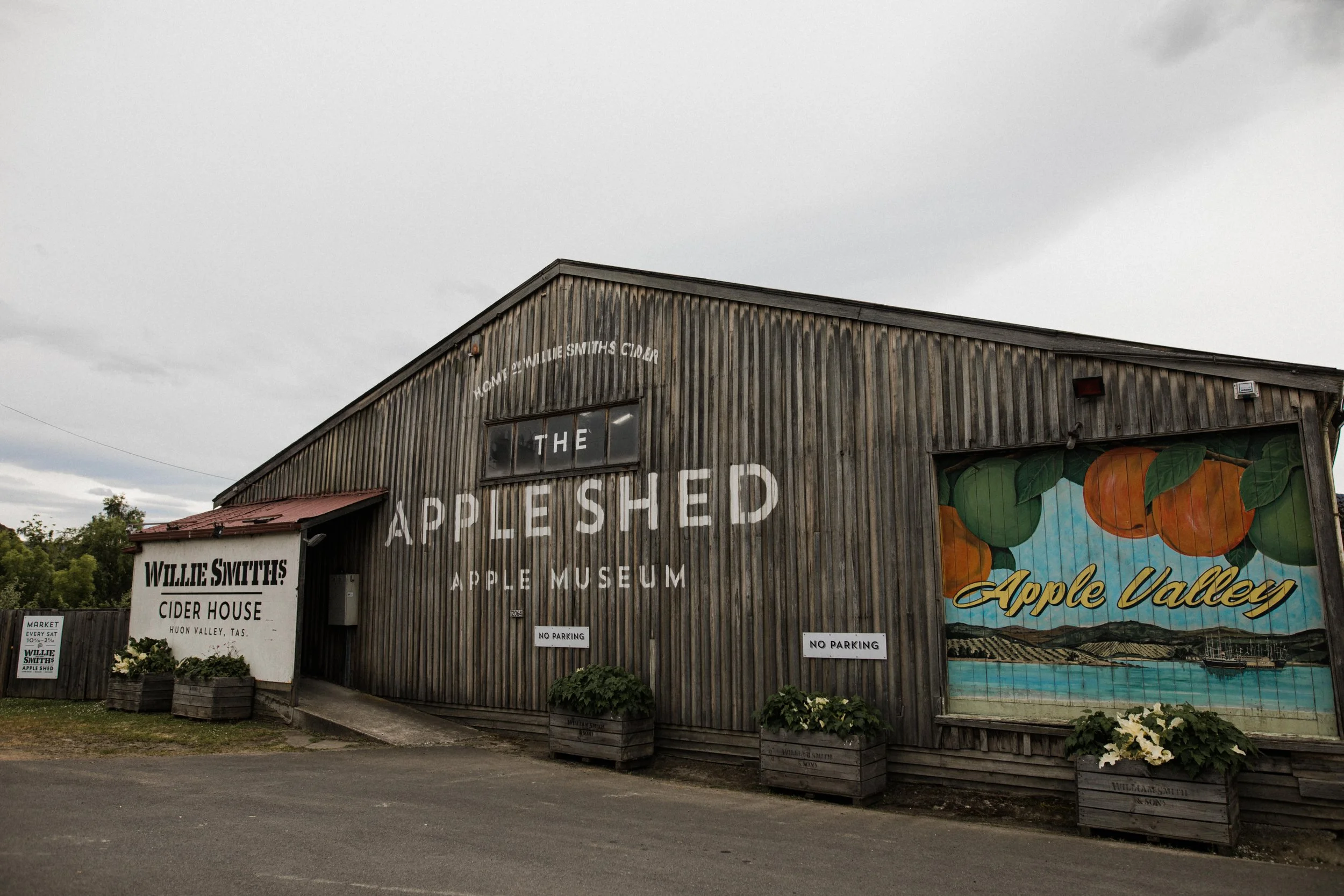 Barn with painted signs for Wille Smith's Cider House and Apple Valley inside the Apple Museum, Huon Valley, Tasmania.