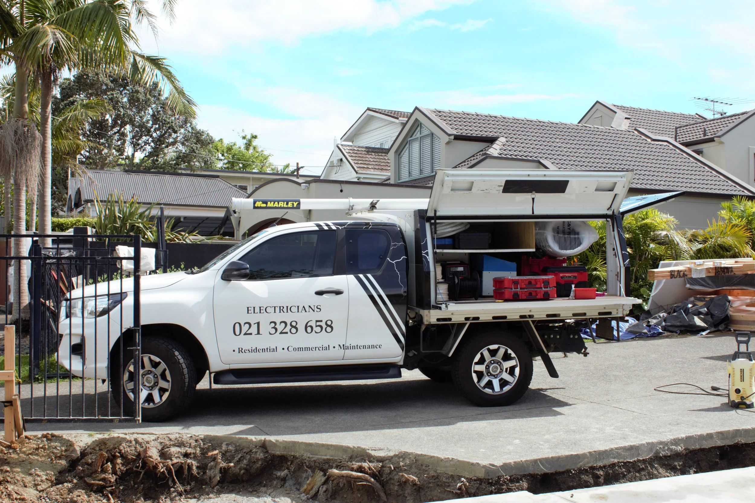 Volt Solutions electricians completing renovation electrical work at a residential property in Devonport, Auckland. Volt Solutions Truck in image on a sunny day.
