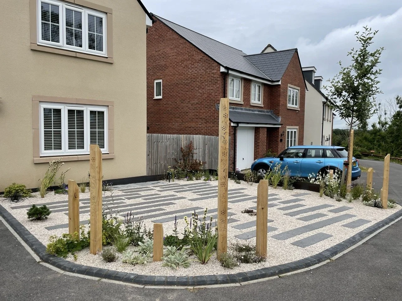 New Build front garden with secret driveway