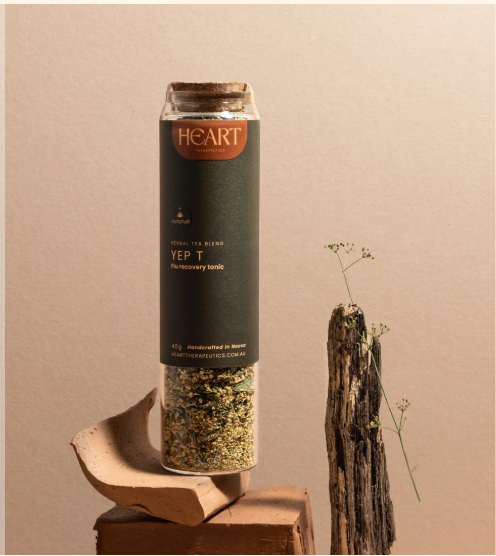 Tall glass jar with a cork stopper and a green label filled with Yep T - Flu Recovery Tonic 40g