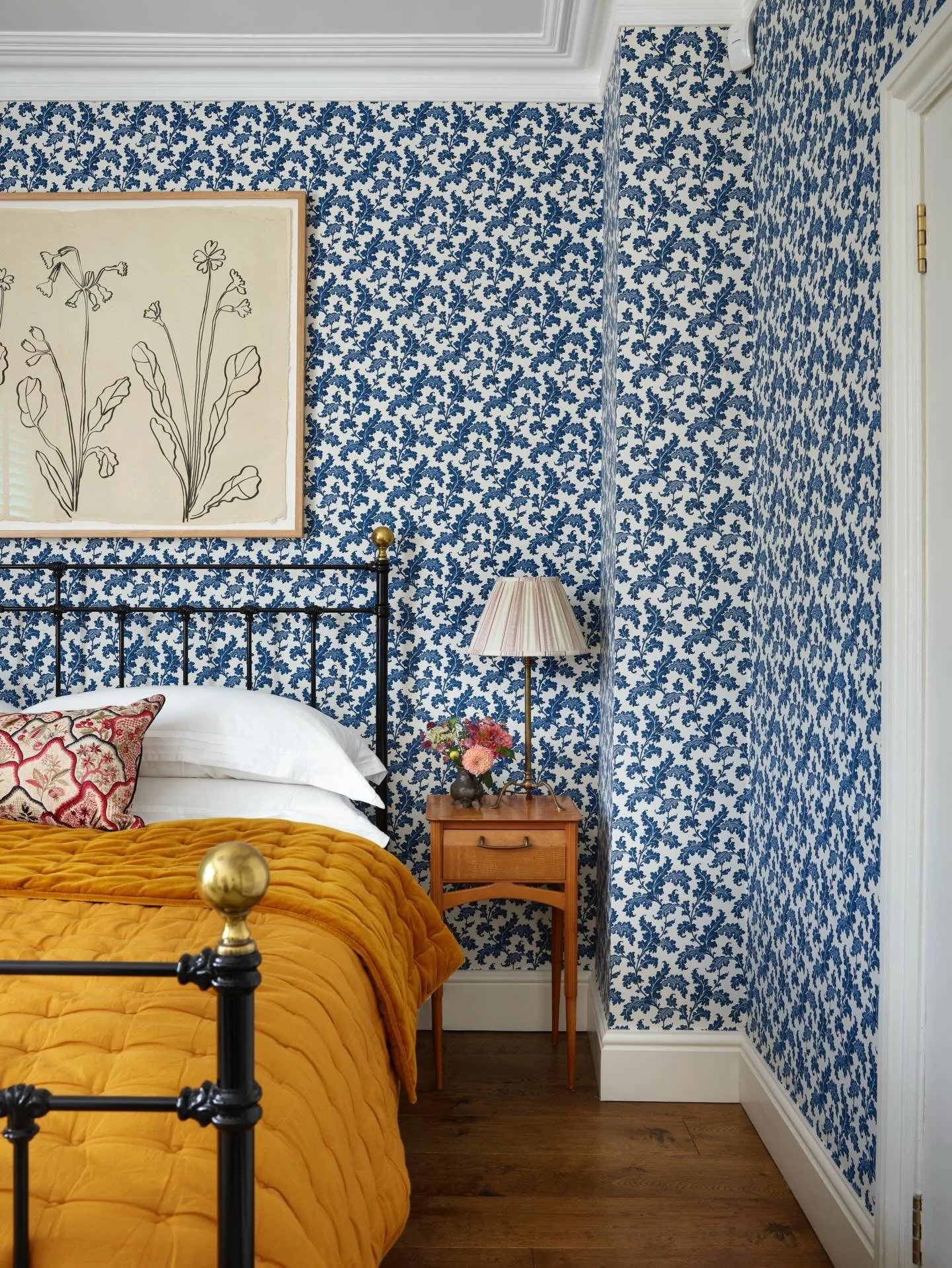 A beautifully bold bedroom from a project in Oxford.  Our client loved this Scrolling Acanthus wallpaper from @soanebritain 💙🤍💙🤍 working as the perfect ground for the &lsquo;Primula&rsquo; ink on Indian rag paper drawing above the bed by @hugogui