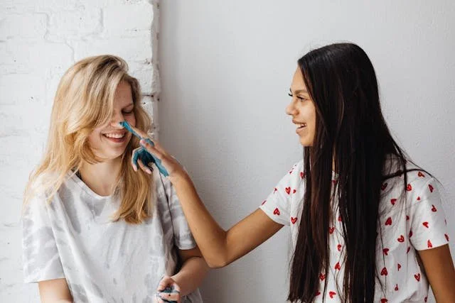 teen-putting-paint-on-nose