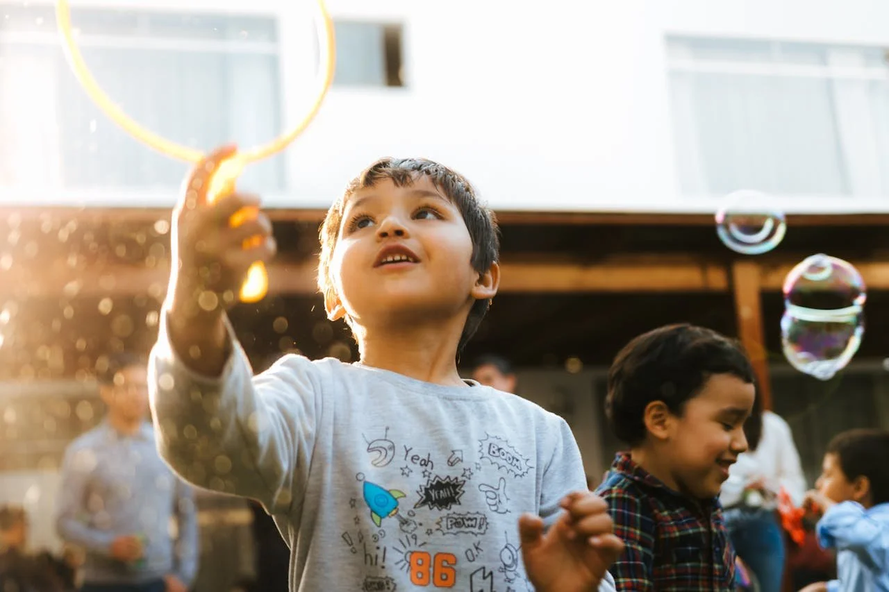 little-boy-playing-with-a-bubble