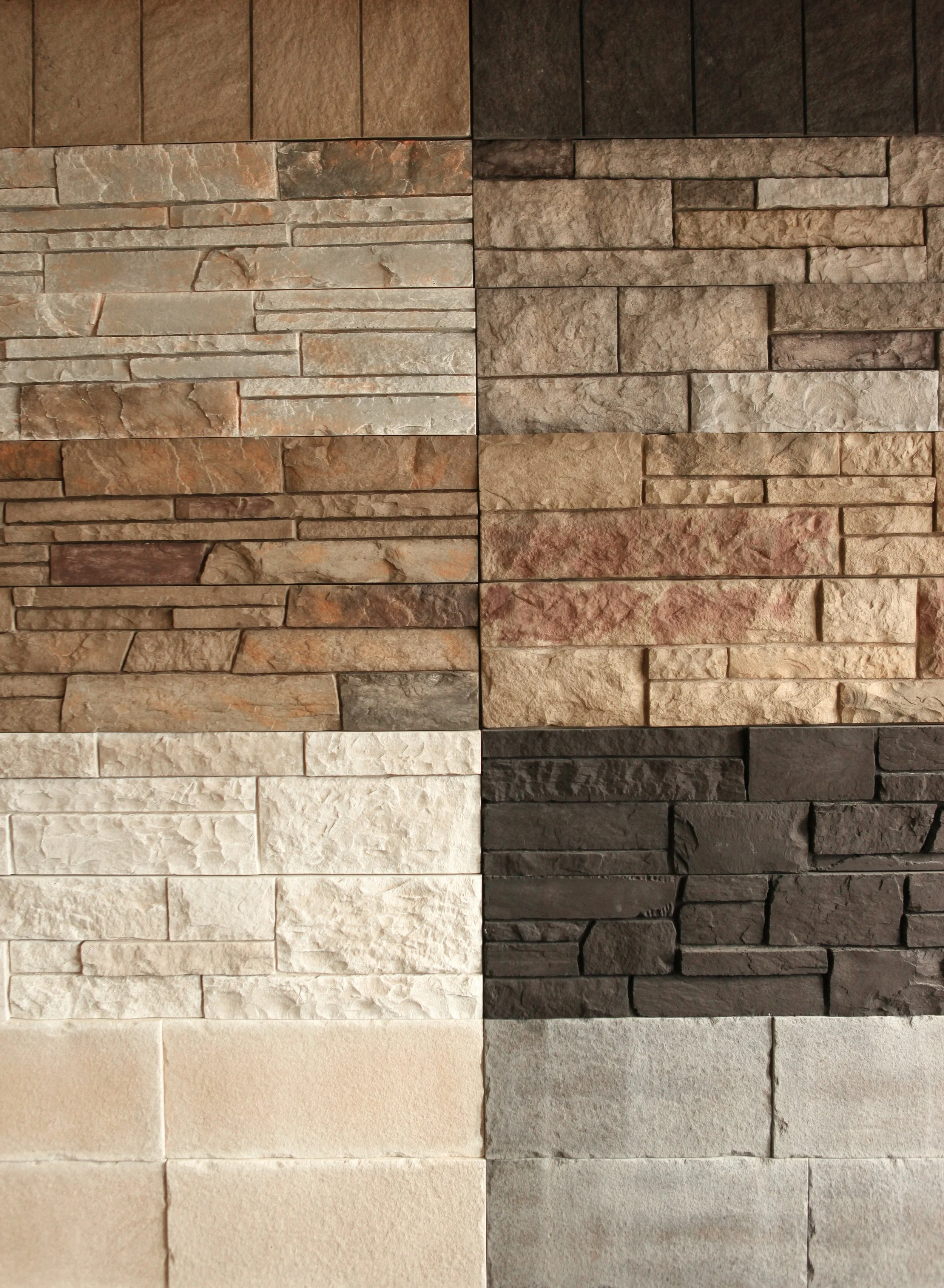 A collage of eight different types of stone wall tiles arranged in a 2x4 grid.