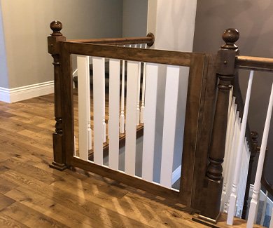 Two tone safety gate at top of stairs