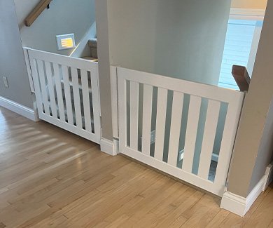 Dual gates in white painted wood