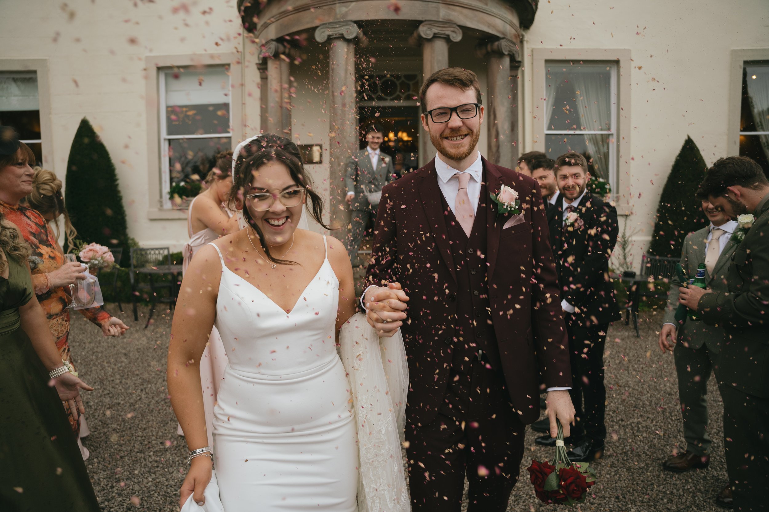 Couple confetti shot outside of Lake District Venue
