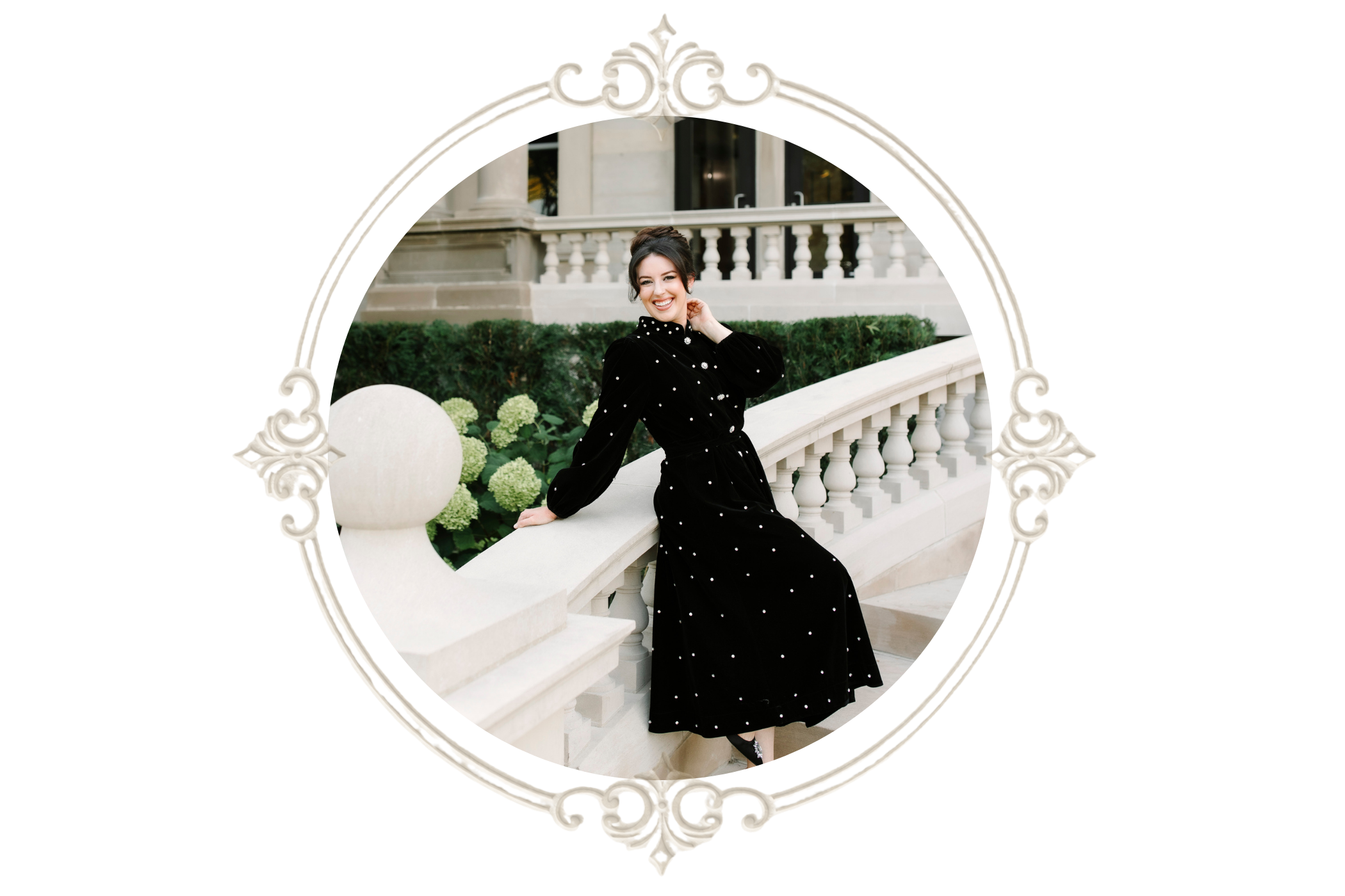Smiling woman in a black pearl-detailed dress posing on an elegant white stone staircase inside an ornate oval frame