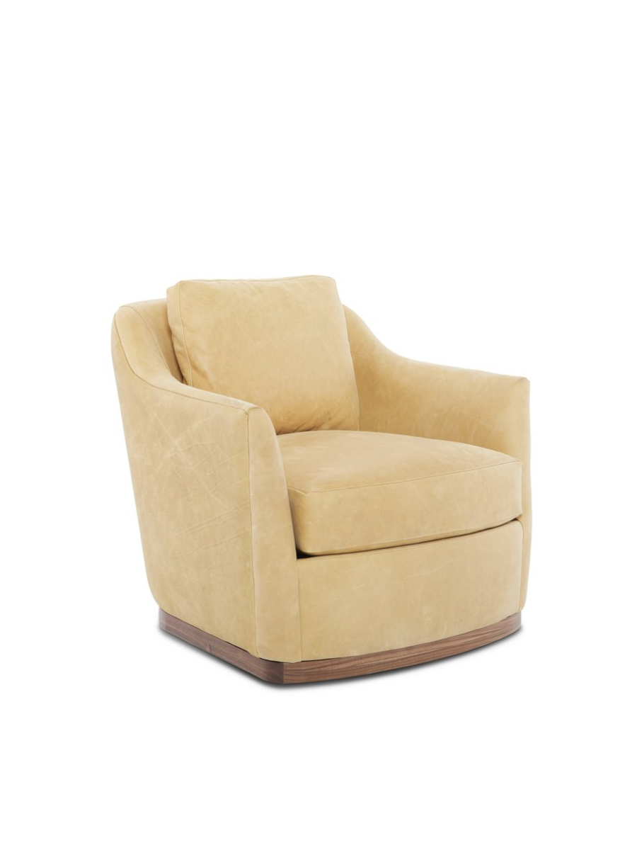 The Remy Swivel Chair by Younger Furniture is shown in a light leather upholstery finish with a smooth wood base.