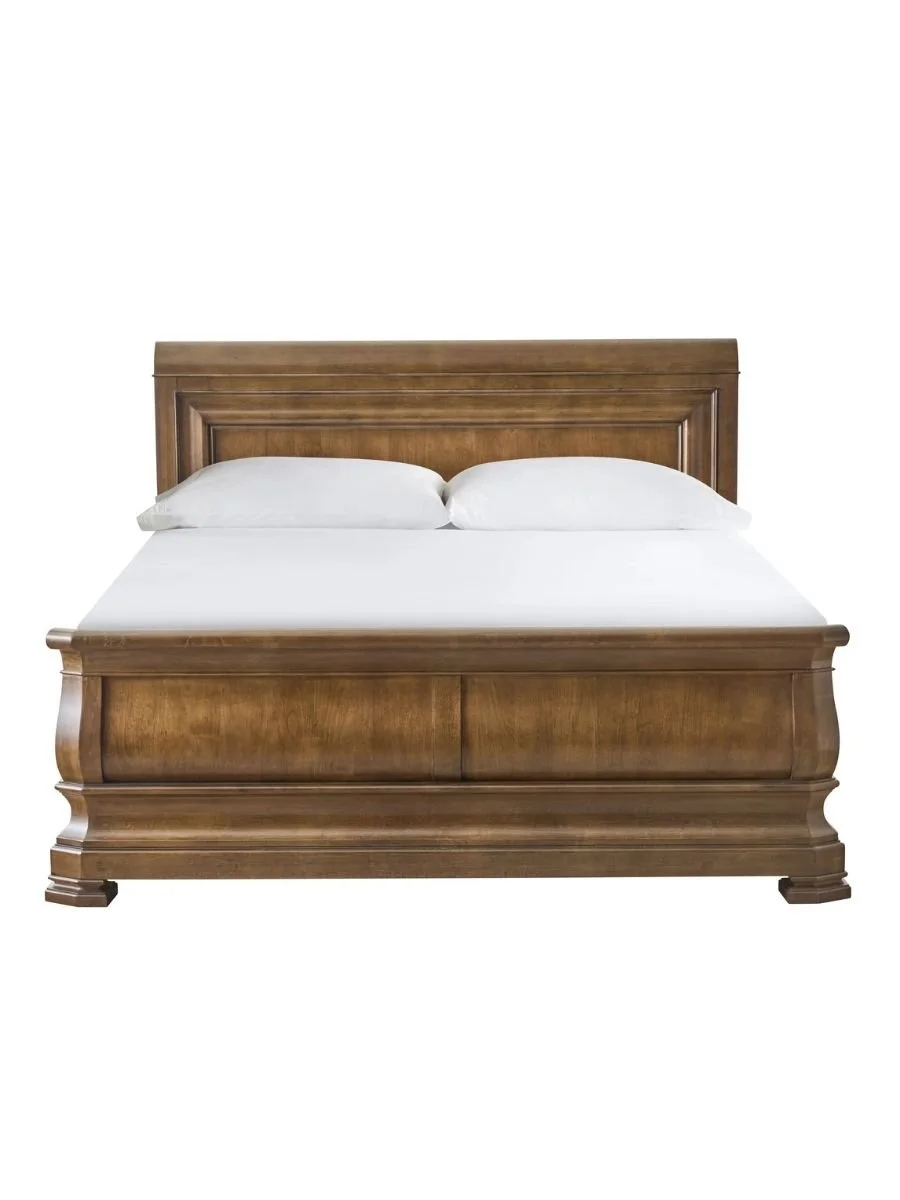 Universal Furniture New Lou Louie queen sleigh bed in cognac with Louis Philippe-inspired styling, available in queen, king, and California king at Curated Furnishings in Richmond, VA