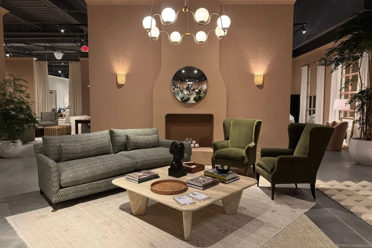 Modern traditional living room featuring a pair of green velvet wingback chairs with clean lines and classic detailing by Rowe Furniture.