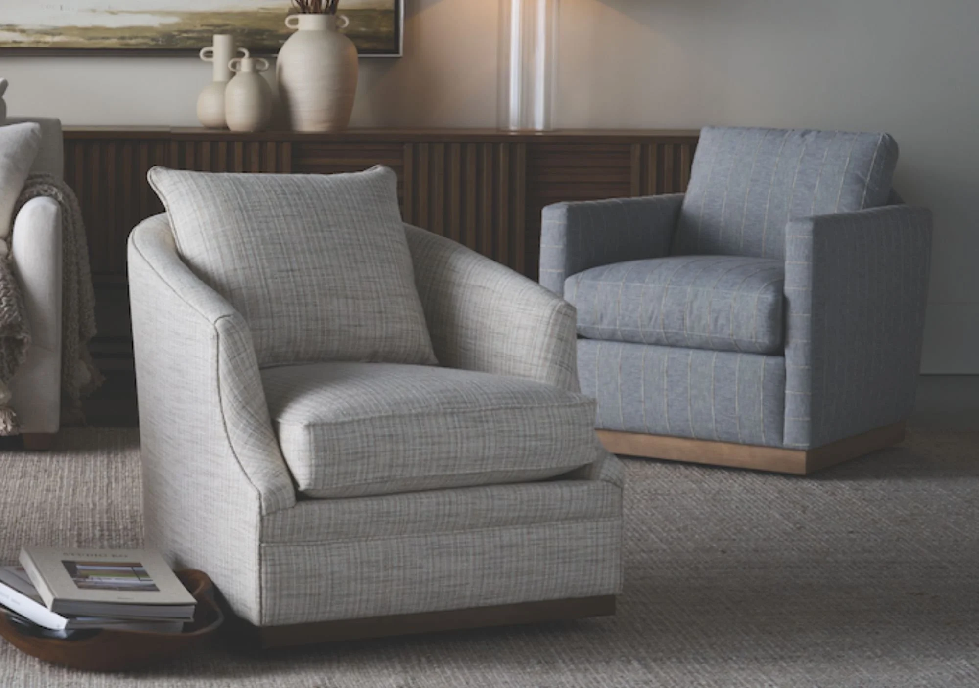 Two Rowe swivel chairs arranged in a living room seating area.