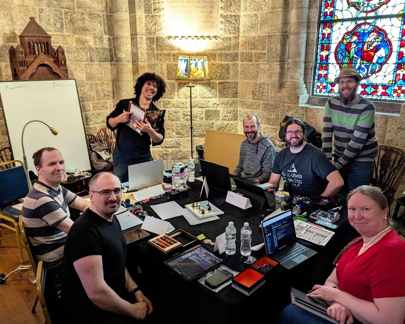 Players and a game master running an immersive tabletop RPG session in a castle setting, similar to Dungeons & Dragons, Pathfinder, World of Darkness, and Call of Cthulhu.