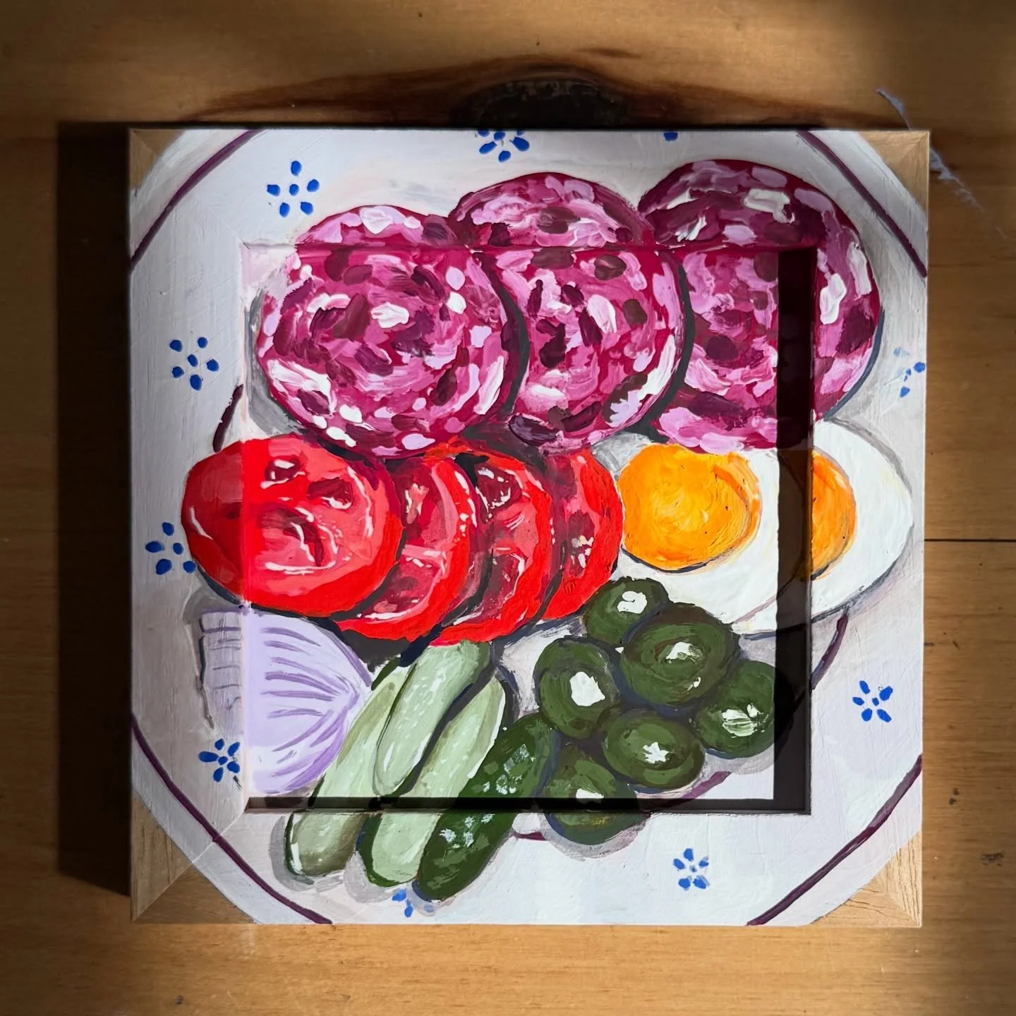 Painting plates of fruits and veggies to remind you that I will be at the Hollywood Farmer&rsquo;s Market again this Sunday! @thehfm 🥒🫒🥓🥚🍓🫐🫜