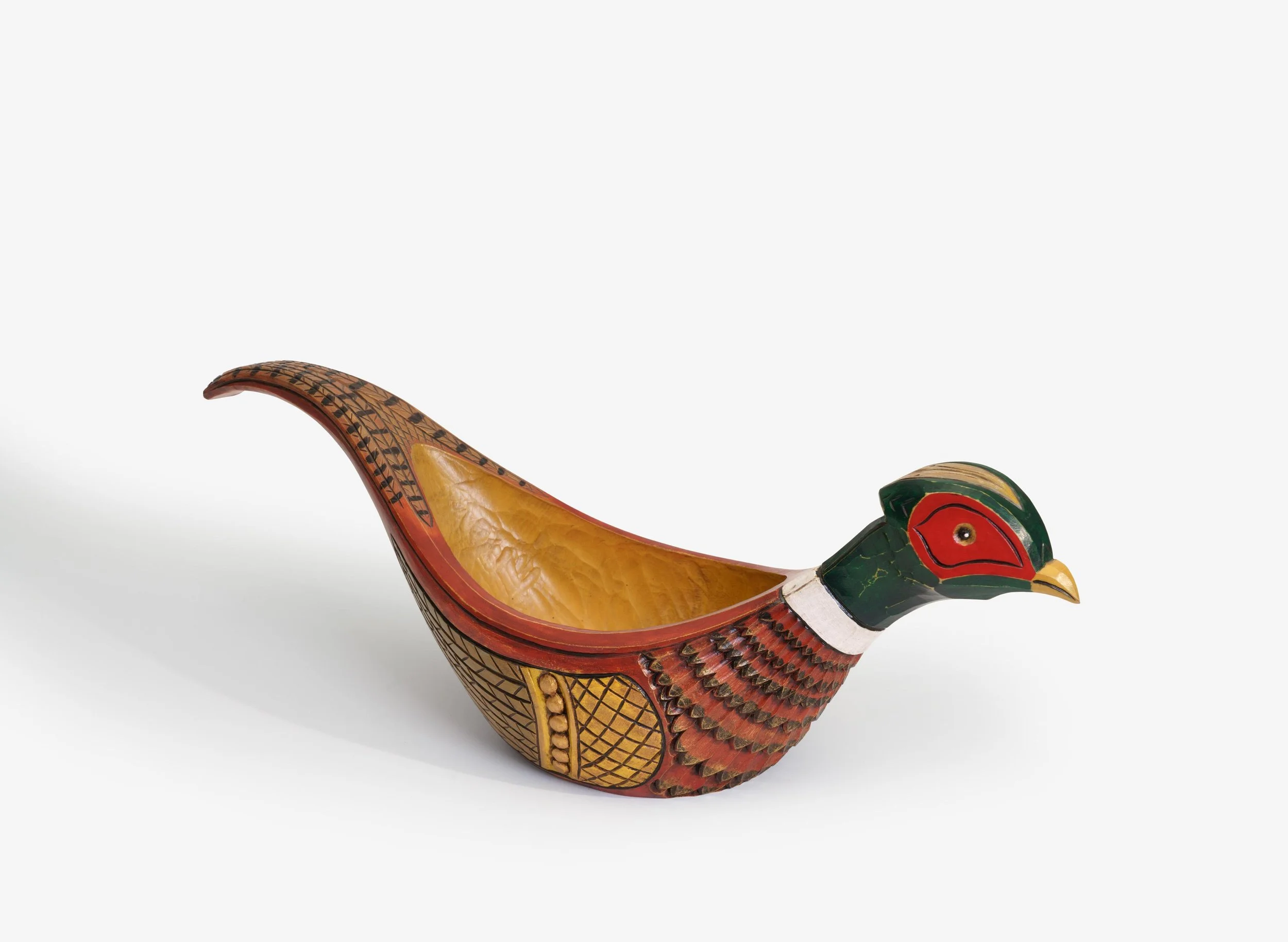 Decorative carved wooden bird-shaped container in green, red, yellow, and black with intricate patterns and a hollow interior.