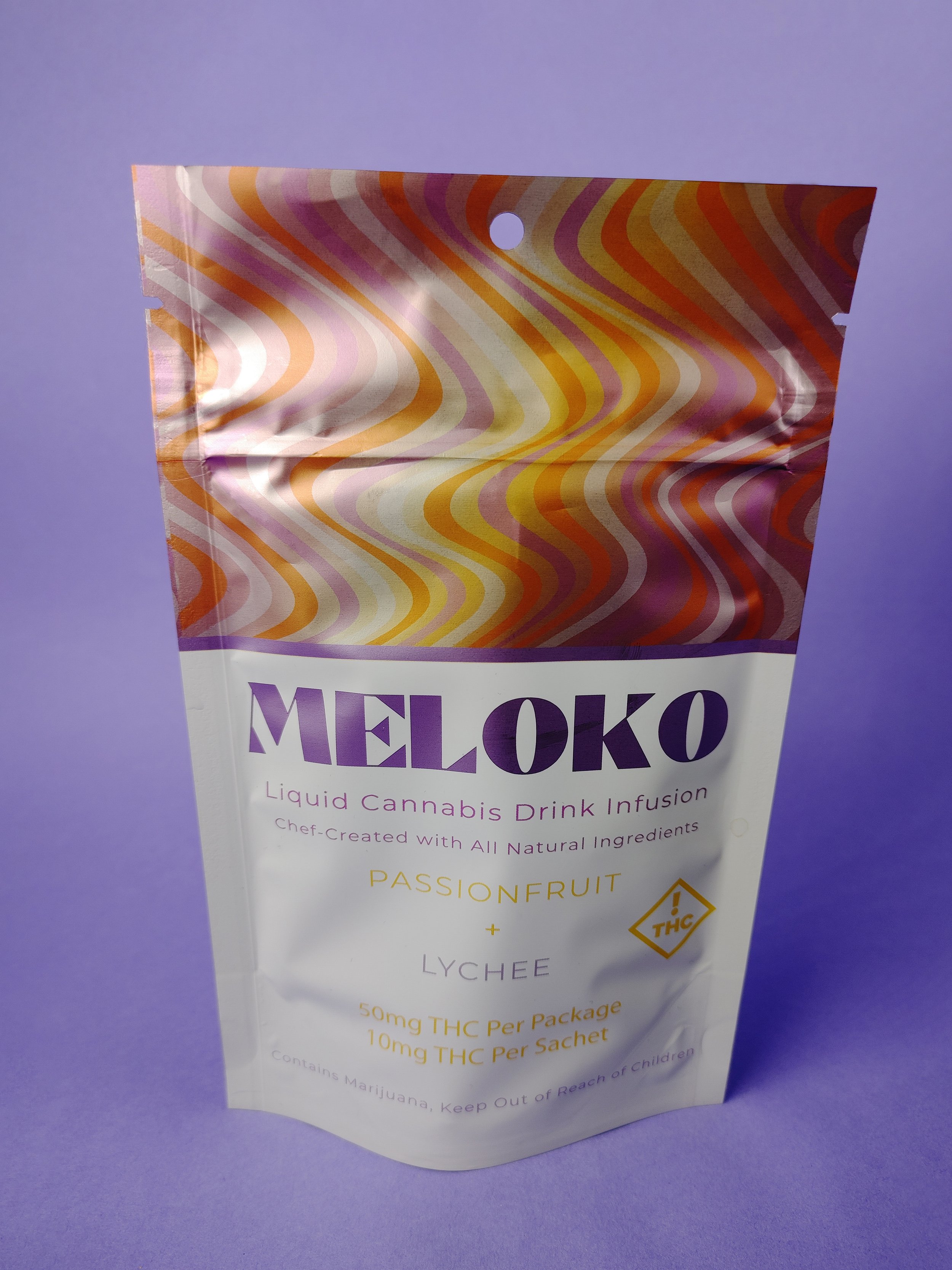 Plain Aesthetic Passion Fruit and Lychee on a purple background Meloko pouch stands upright