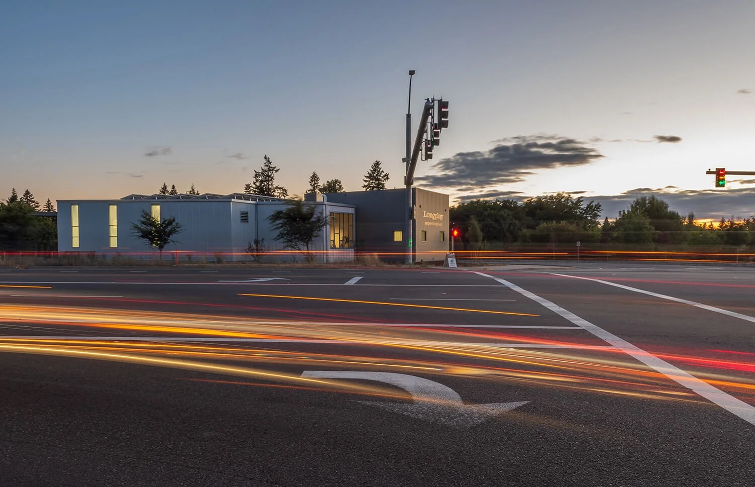 A long exposure of Longplay Wines building from across the road. Passing traffic creates light streaks in the photo.