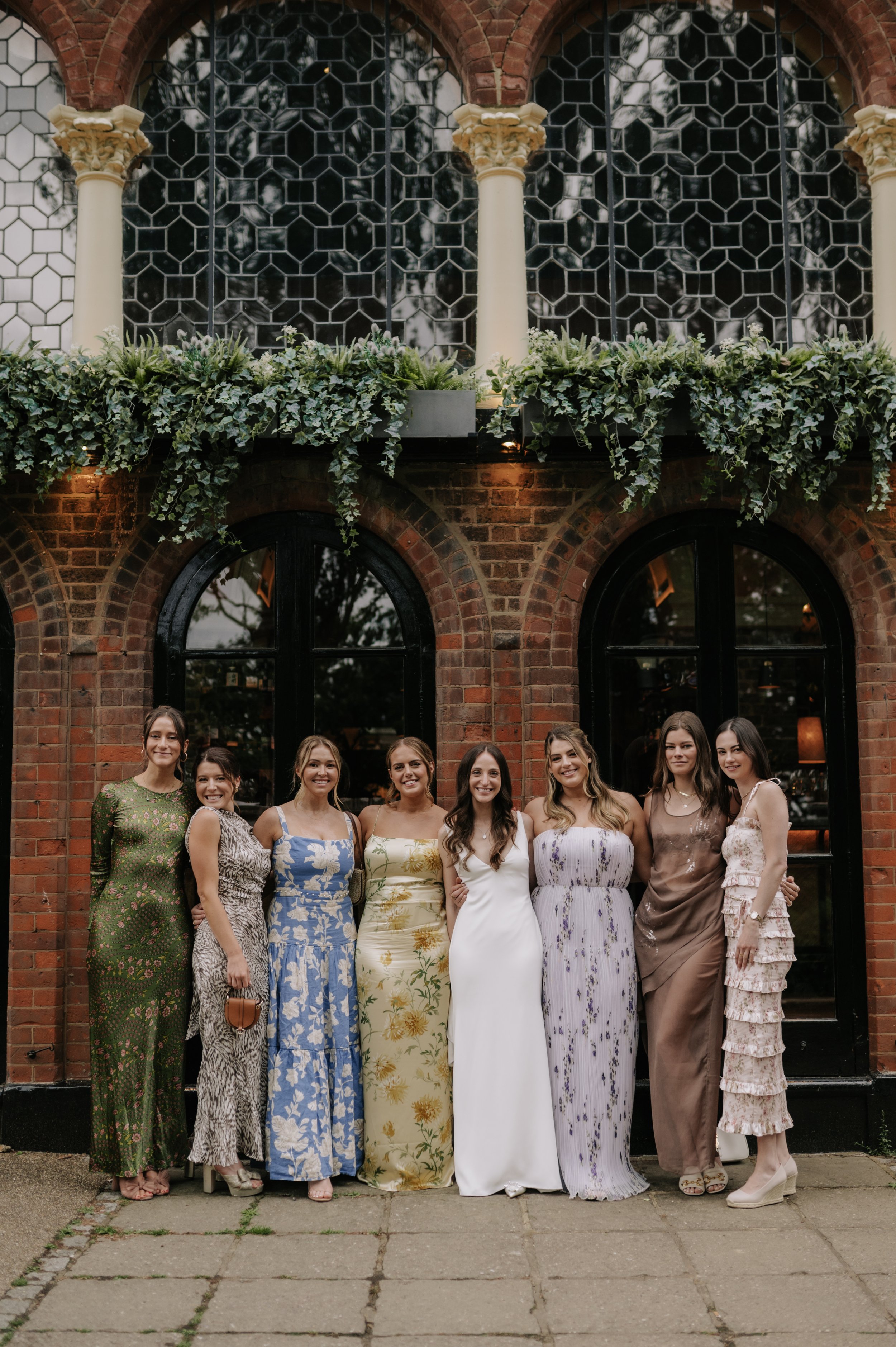 London wedding photography at Belvedere in Holland Park bride and friends smiling at camera 