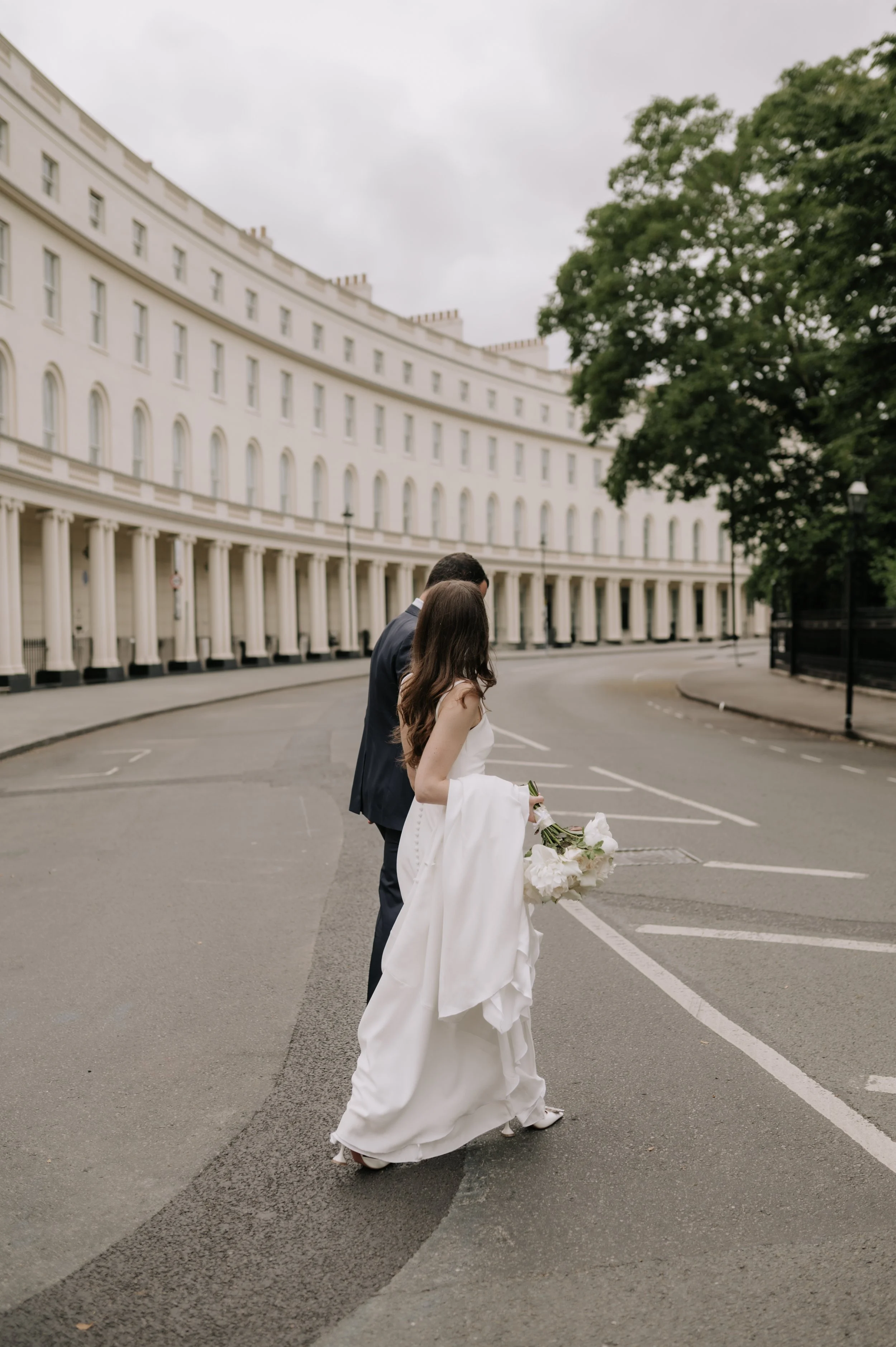 London wedding photography at Marylebone Town Hall bride and groom crossing road