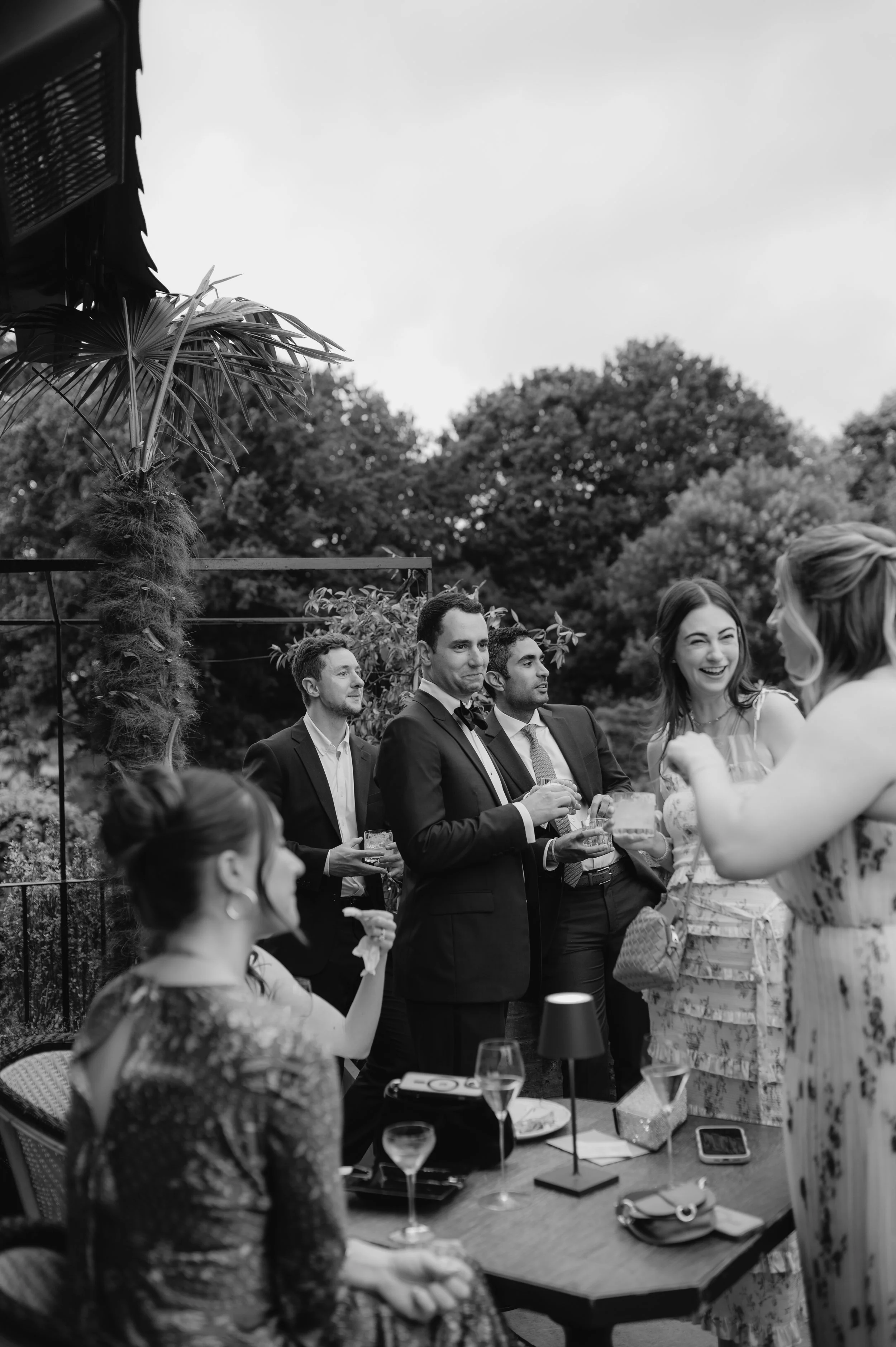 London wedding photography at Belvedere in Holland Park guests chatting