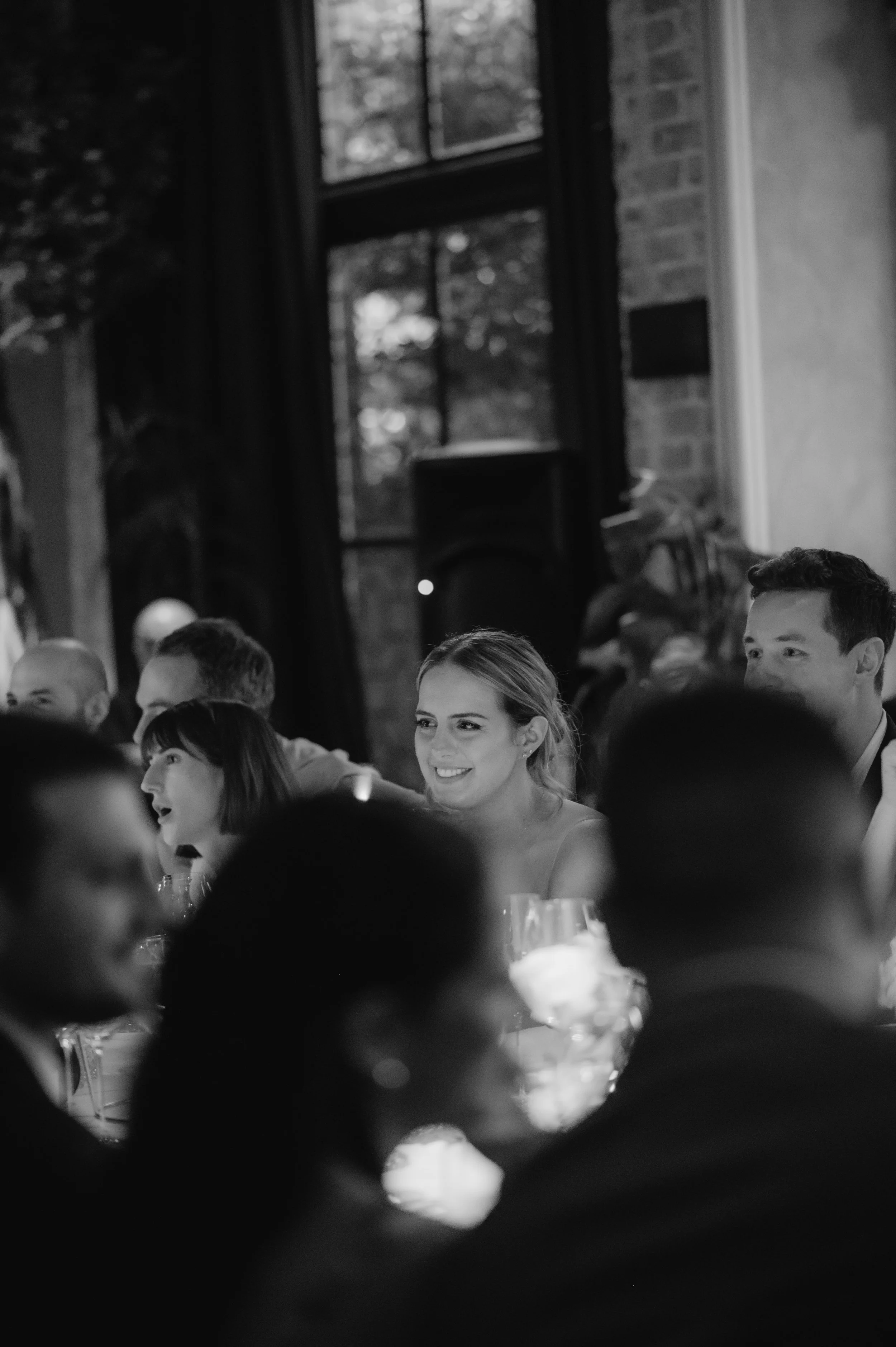 candlelit dinner London wedding photography at Belvedere in Holland Park guest smiling 