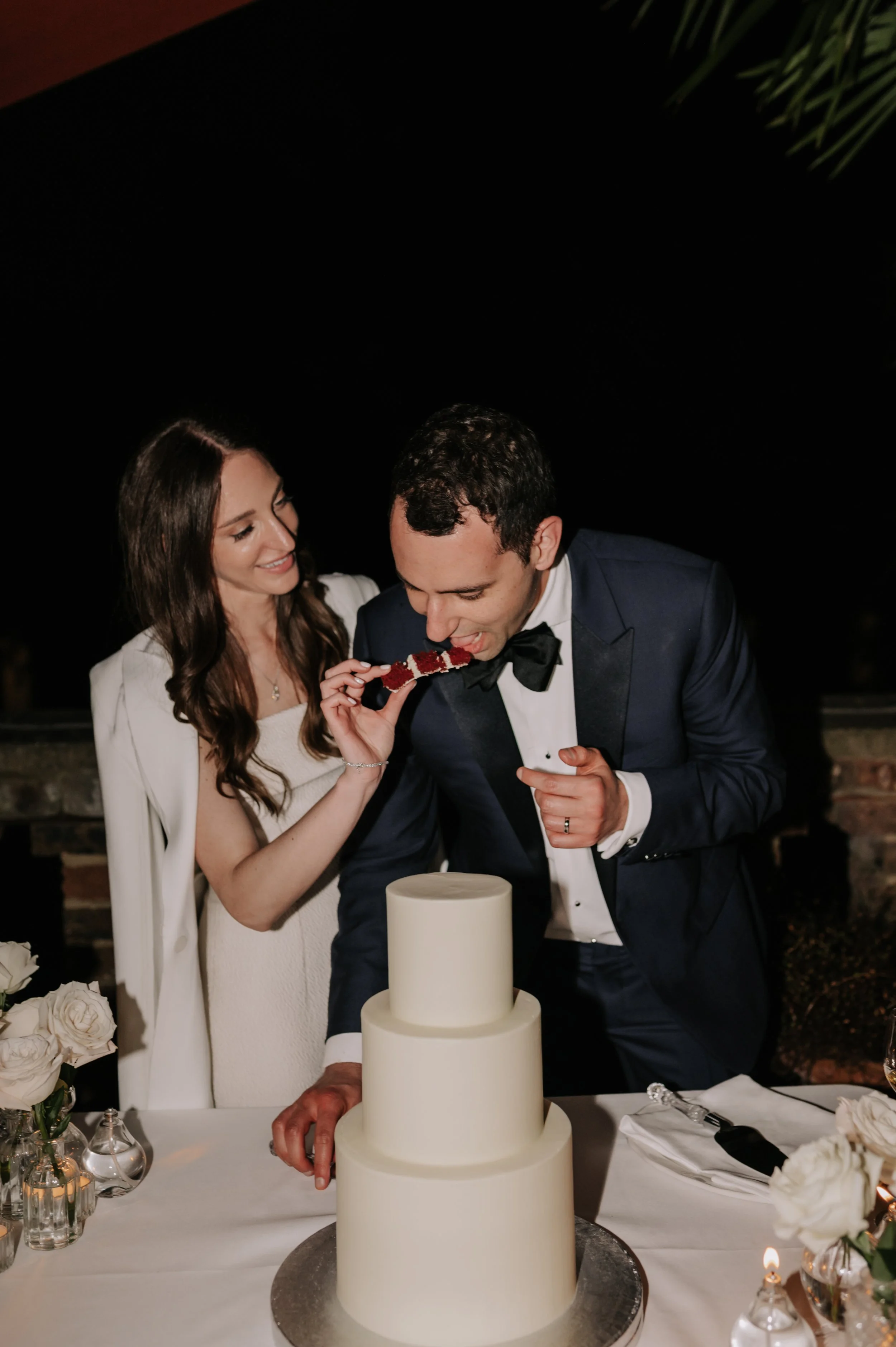 London wedding photography at Belvedere in Holland Park bride and groom cutting cake 
