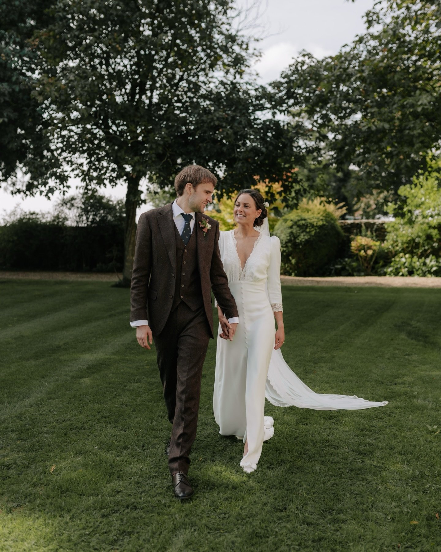 Garden portraits with Rosie &amp; Tommy at their Cotswolds wedding. Amongst the apple trees we took some quiet moments in their day to take their couple portraits. A time to reflect on the day so far, enjoy taking a breather together and capture them