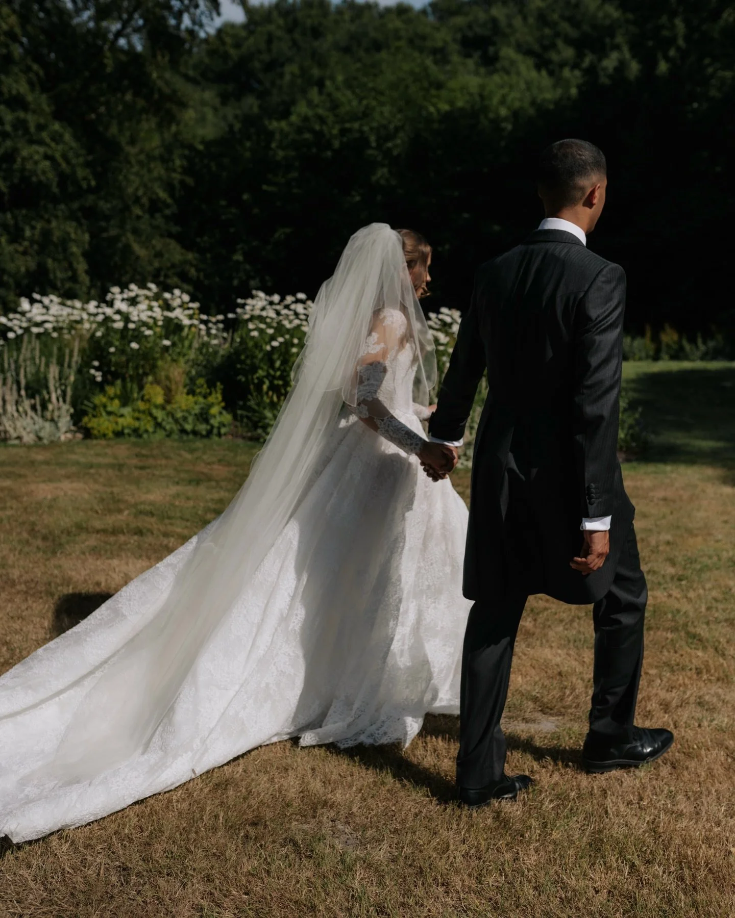 Under the bright afternoon sun in the Sussex countryside, the Hopper-Mitchells became official. 

The day was filled with so many personal touches. The hand painted matchstick boxes, wearing her mum&rsquo;s veil, the personalised vows. All with the b