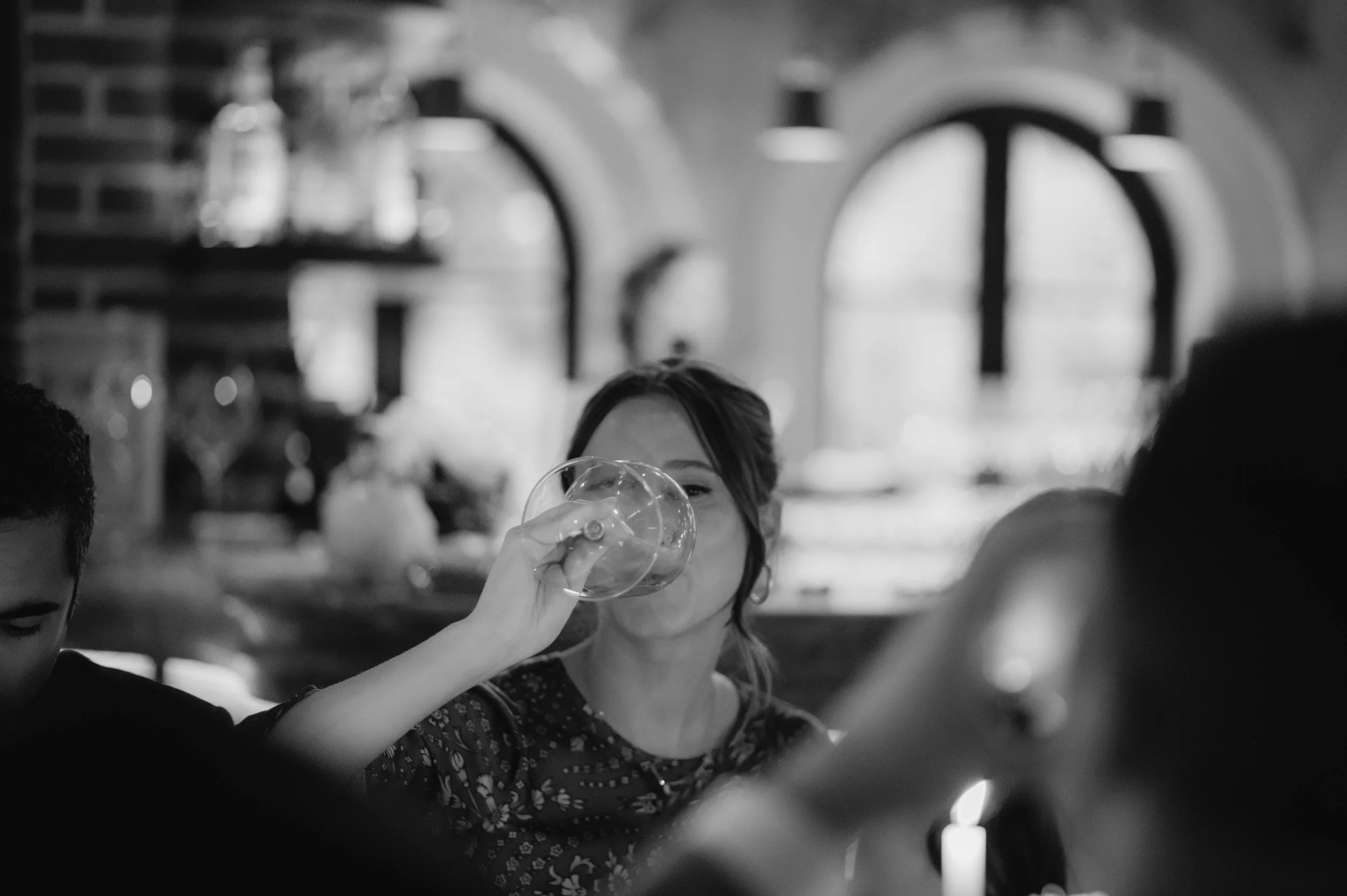 candlelit dinner London wedding photography at Belvedere in Holland Park guest drinking from wine glass 