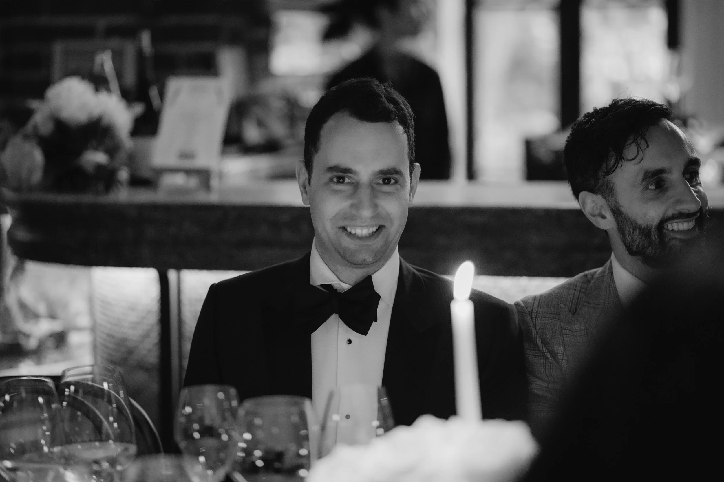 candlelit dinner London wedding photography at Belvedere in Holland Park groom smiling