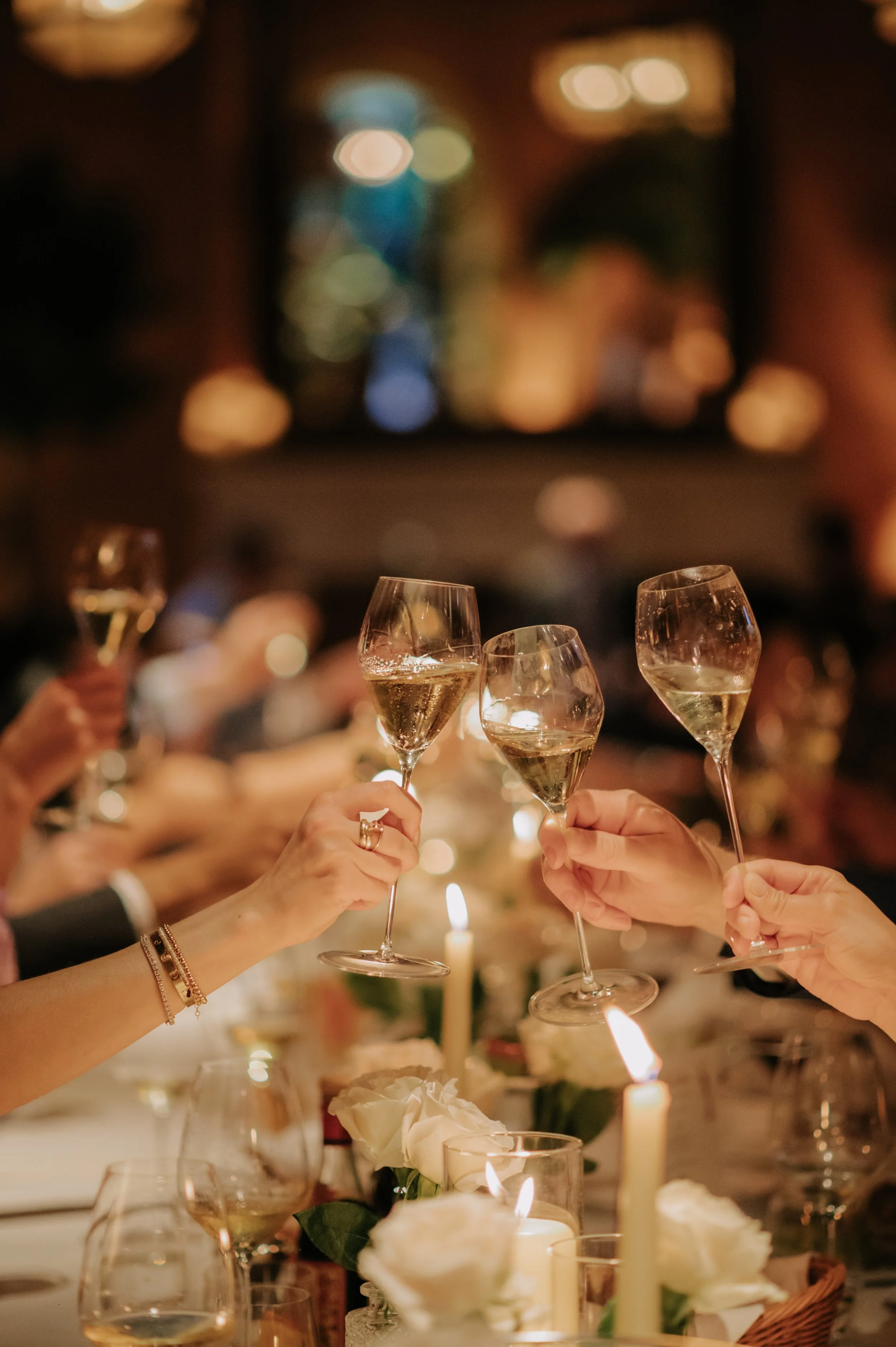 candlelit dinner London wedding photography at Belvedere in Holland Park guests clinking champagne glasses 