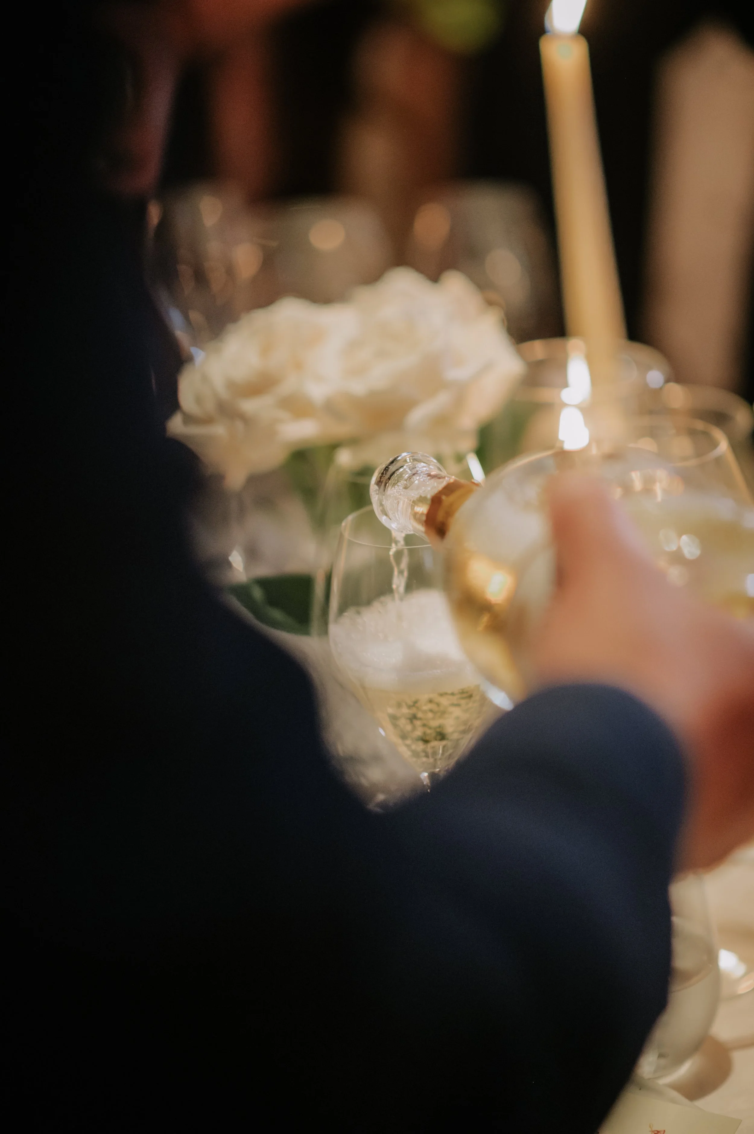candlelit dinner London wedding photography at Belvedere in Holland Park wine being poured 