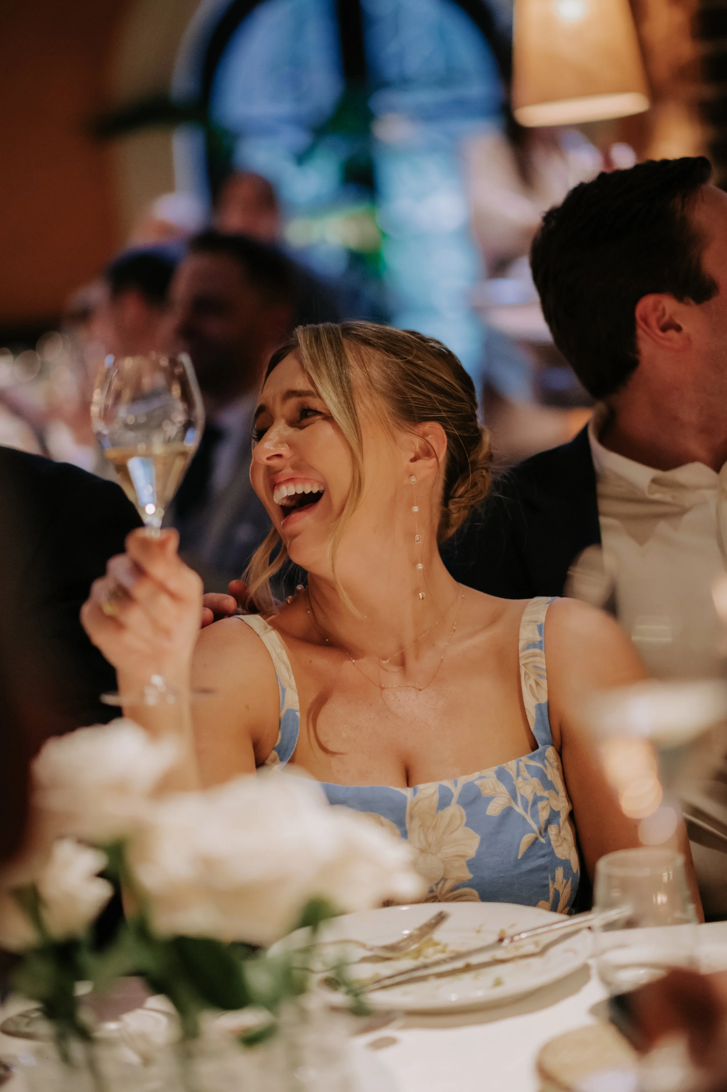 candlelit dinner London wedding photography at Belvedere in Holland Park guest laughing 
