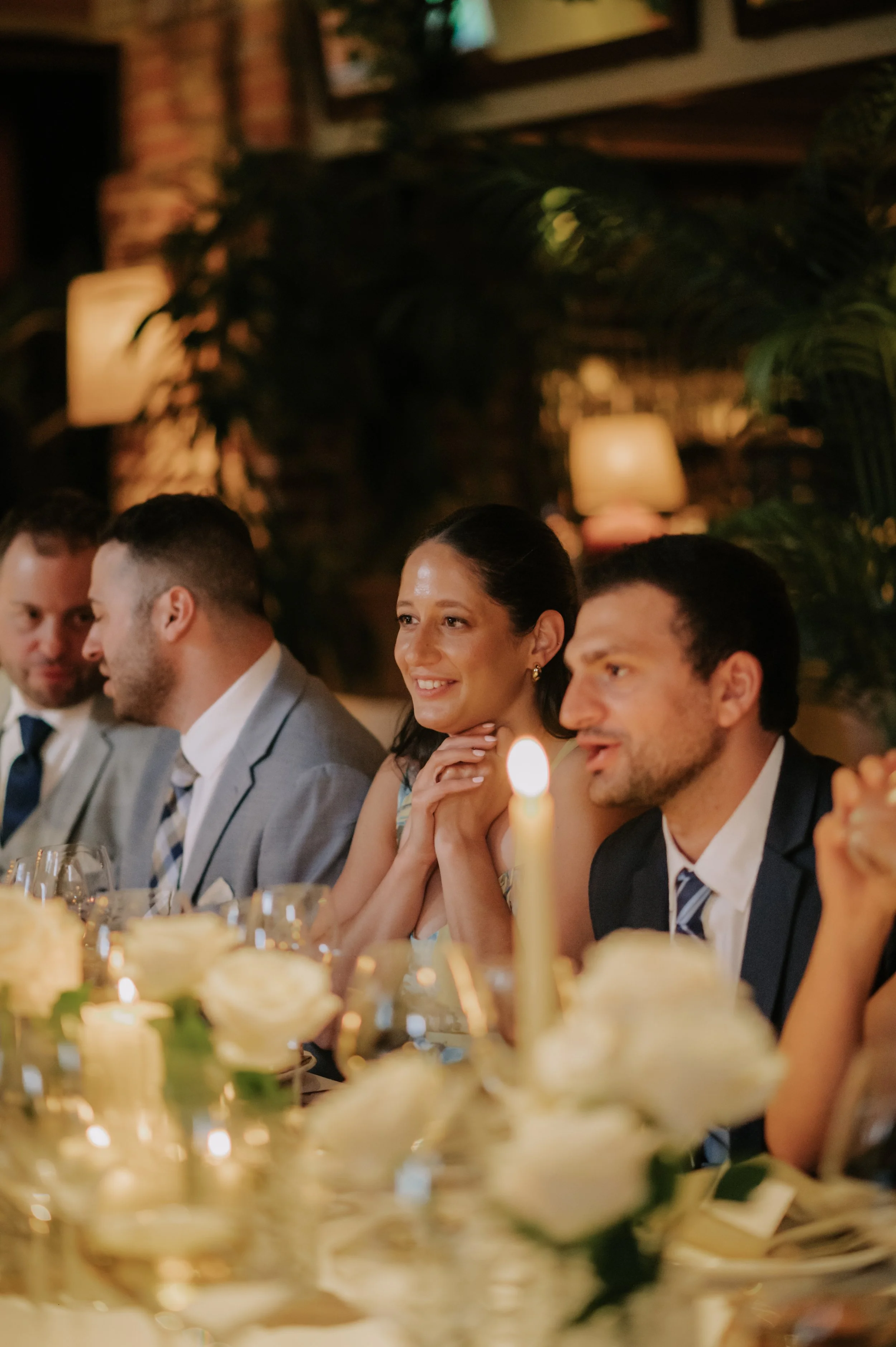 candlelit dinner London wedding photography at Belvedere in Holland Park guest smiling 