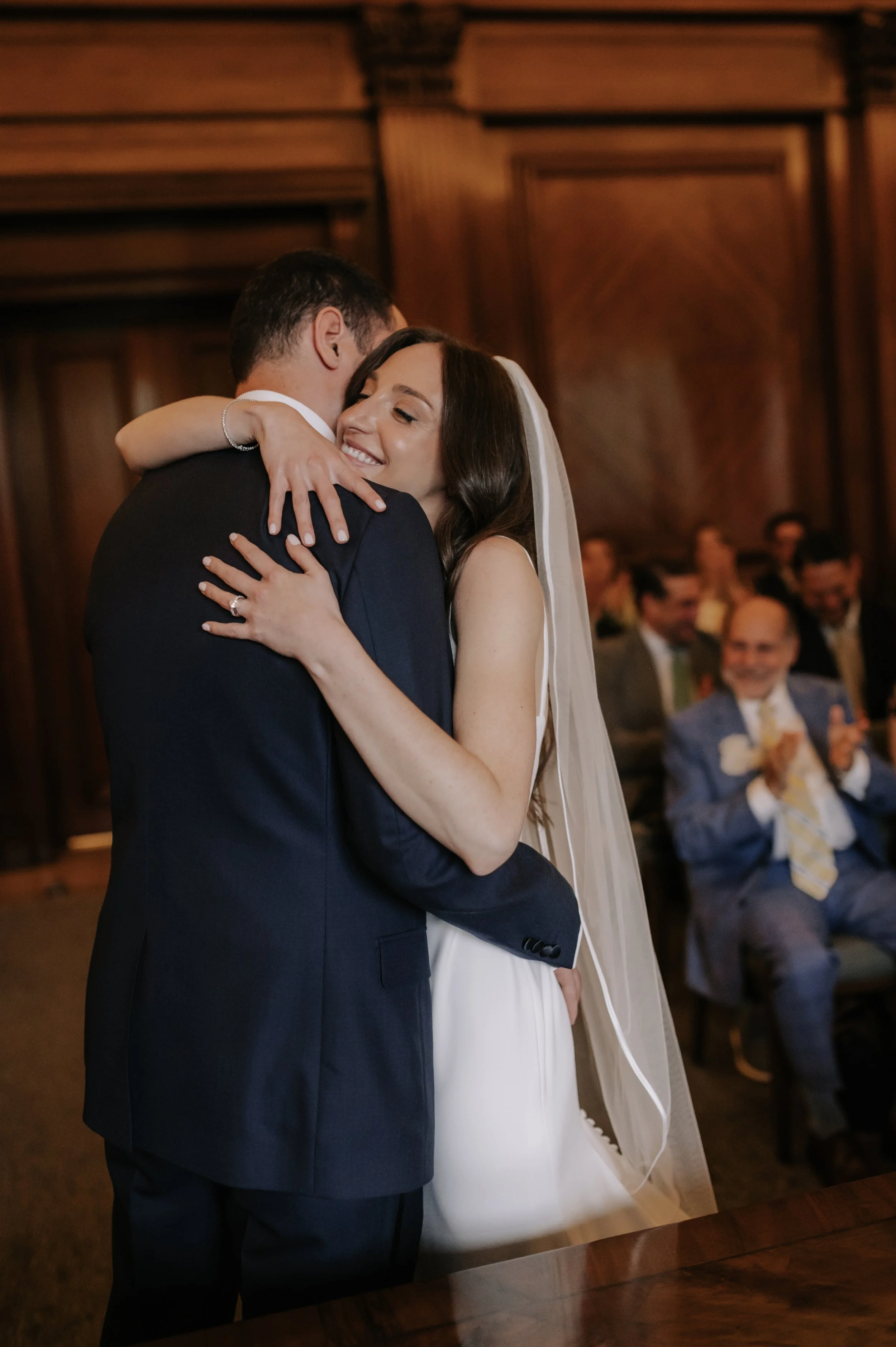 London wedding photography at Marylebone Town Hall bride and groom hugging