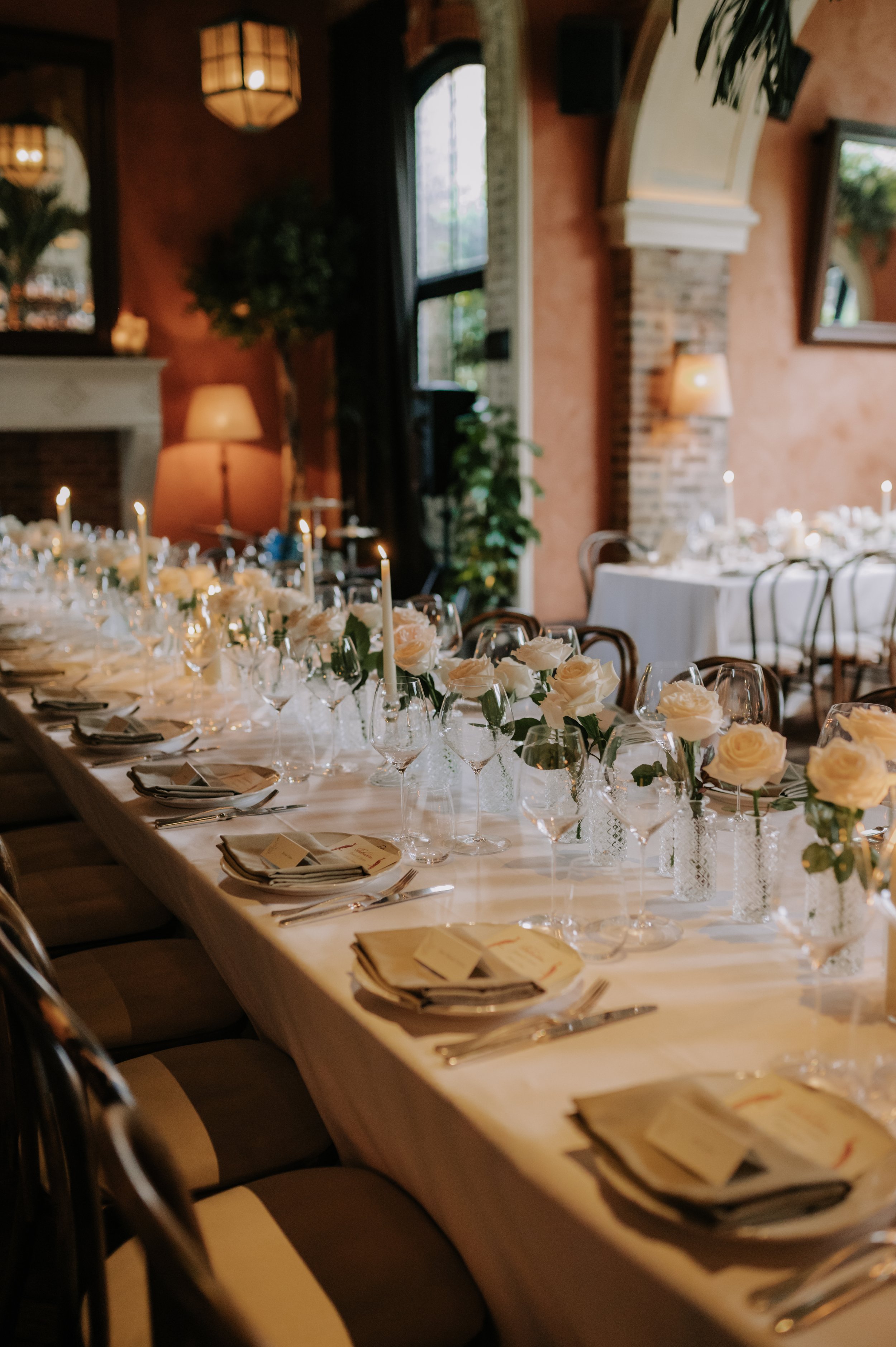 London wedding photography at Belvedere in Holland Park white roses and candles on table set up