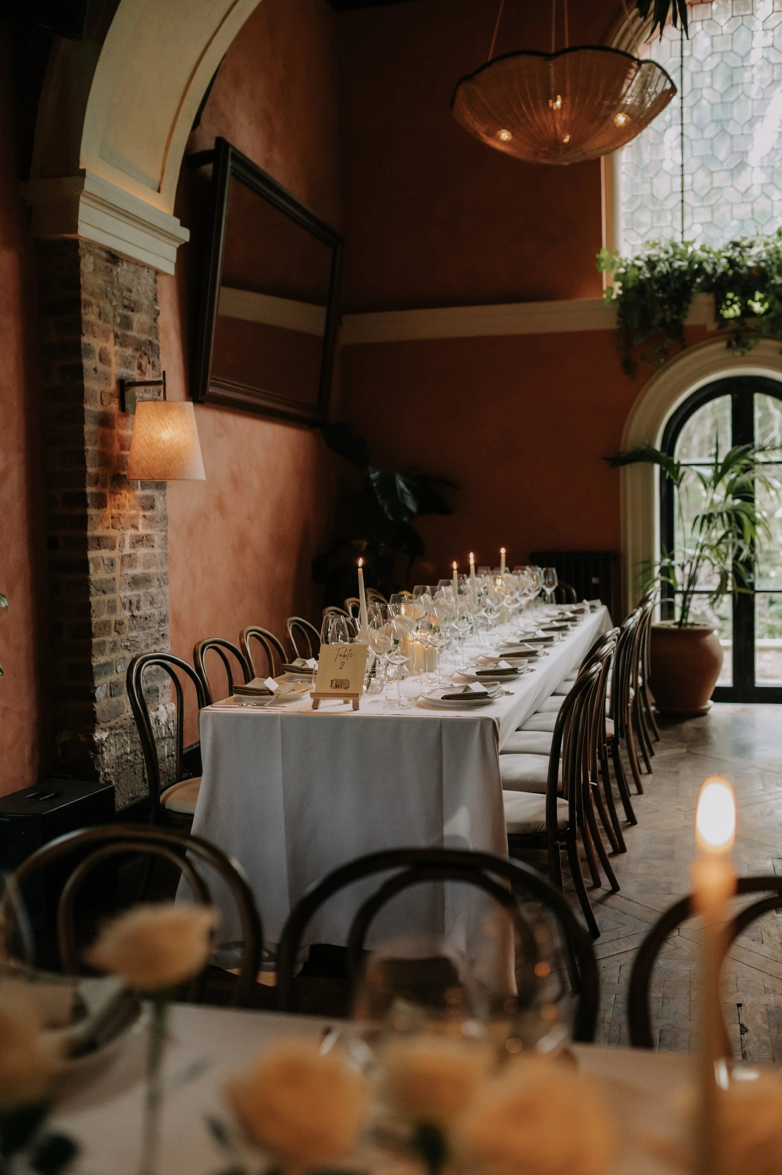 London wedding photography at Belvedere in Holland Park white roses and candles on table set up
